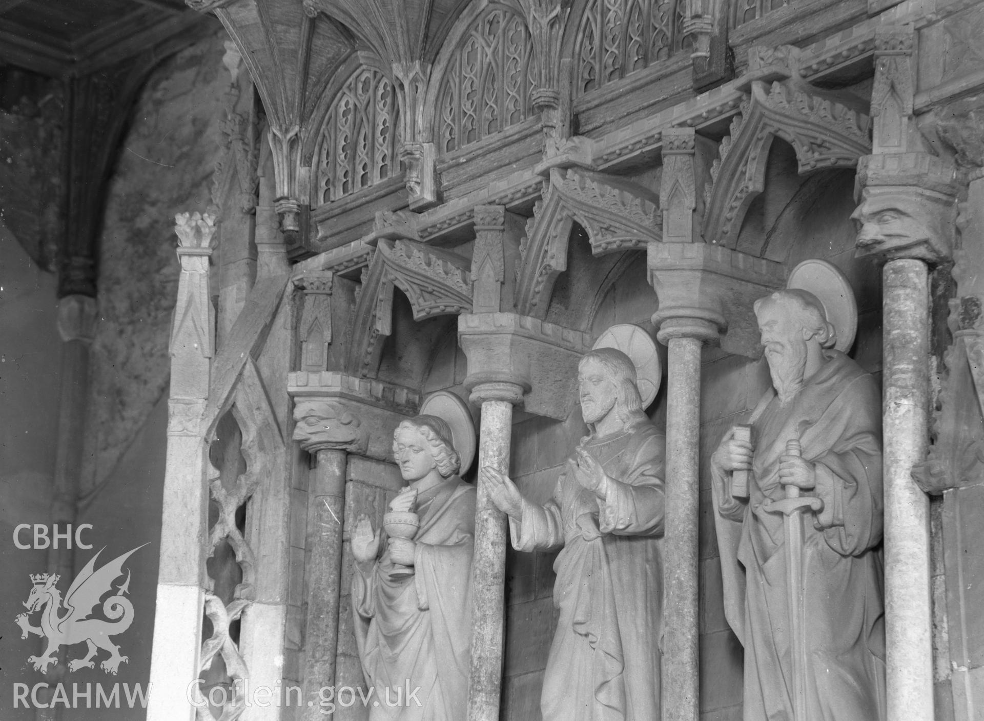 Digital copy of a black and white nitrate negative showing view of Saint's statues at St David's Cathedral, taken by E.W. Lovegrove, July 1936.