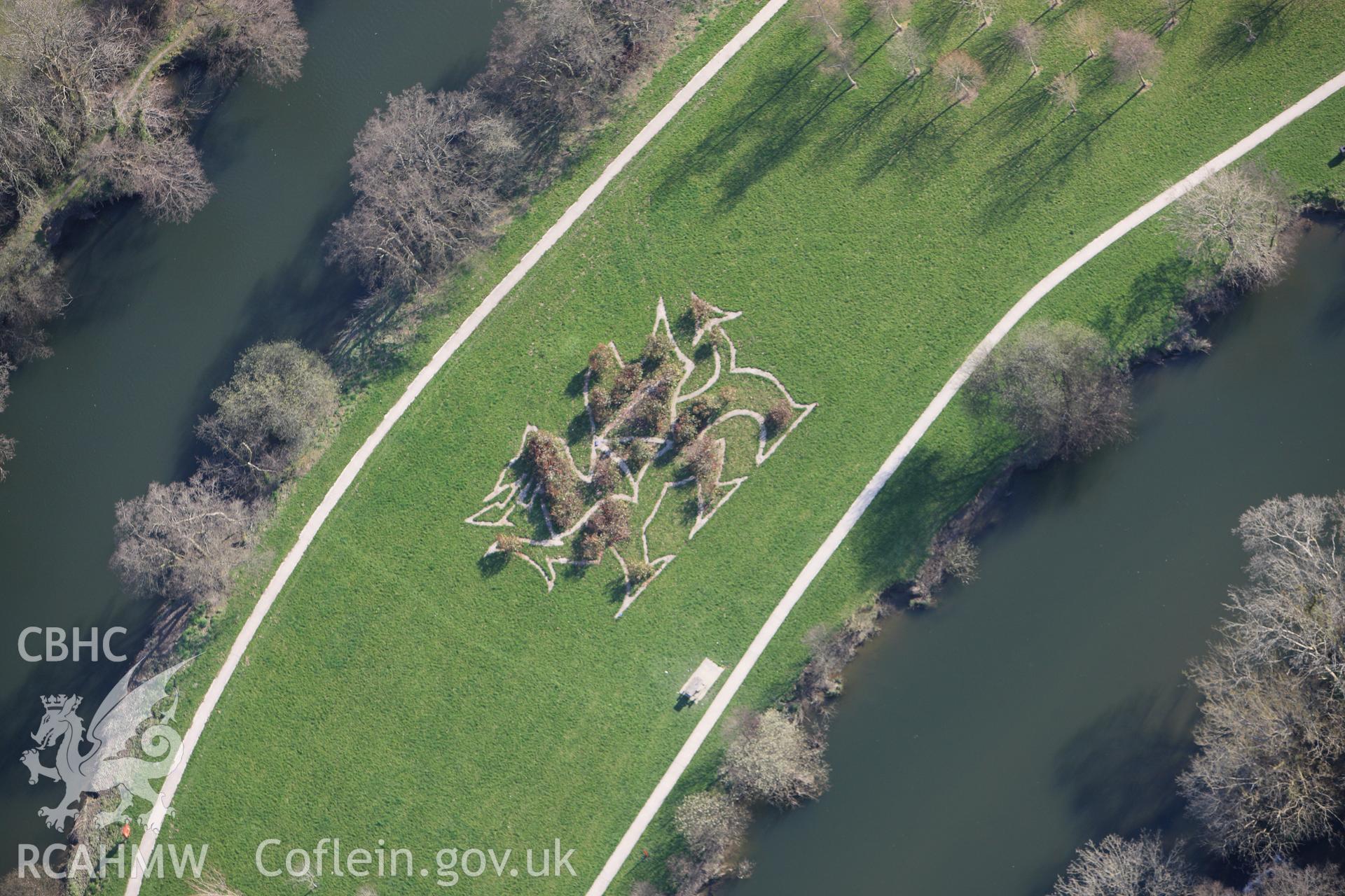 RCAHMW colour oblique aerial photograph of Newcastle Emlyn Castle, showing dragon landscape art on east side of castle. Taken on 13 April 2010 by Toby Driver