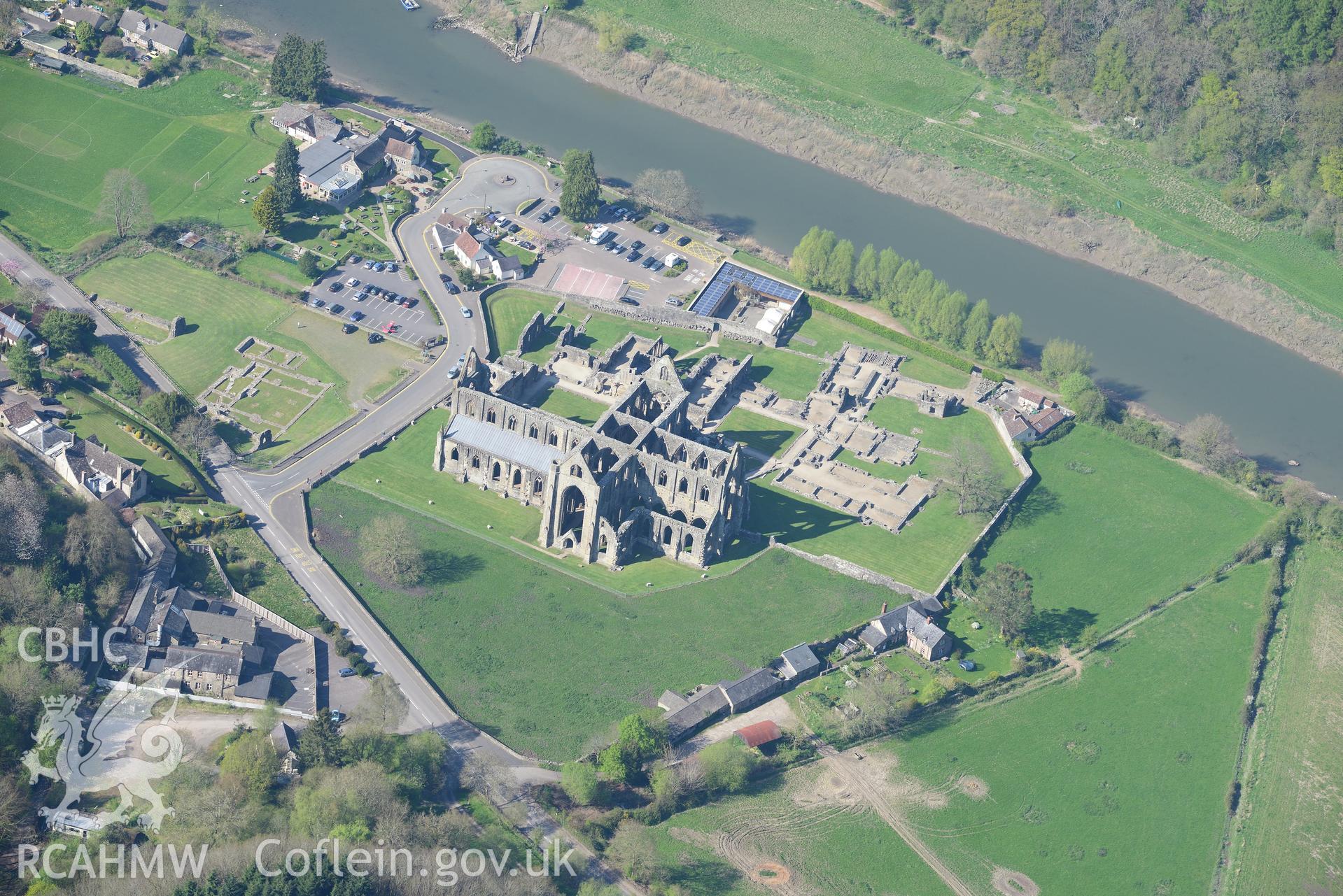 Tintern Abbey, Beaufort Cottage and St. Anne's House. Oblique aerial photograph taken during the Royal Commission's programme of archaeological aerial reconnaissance by Toby Driver on 21st April 2015