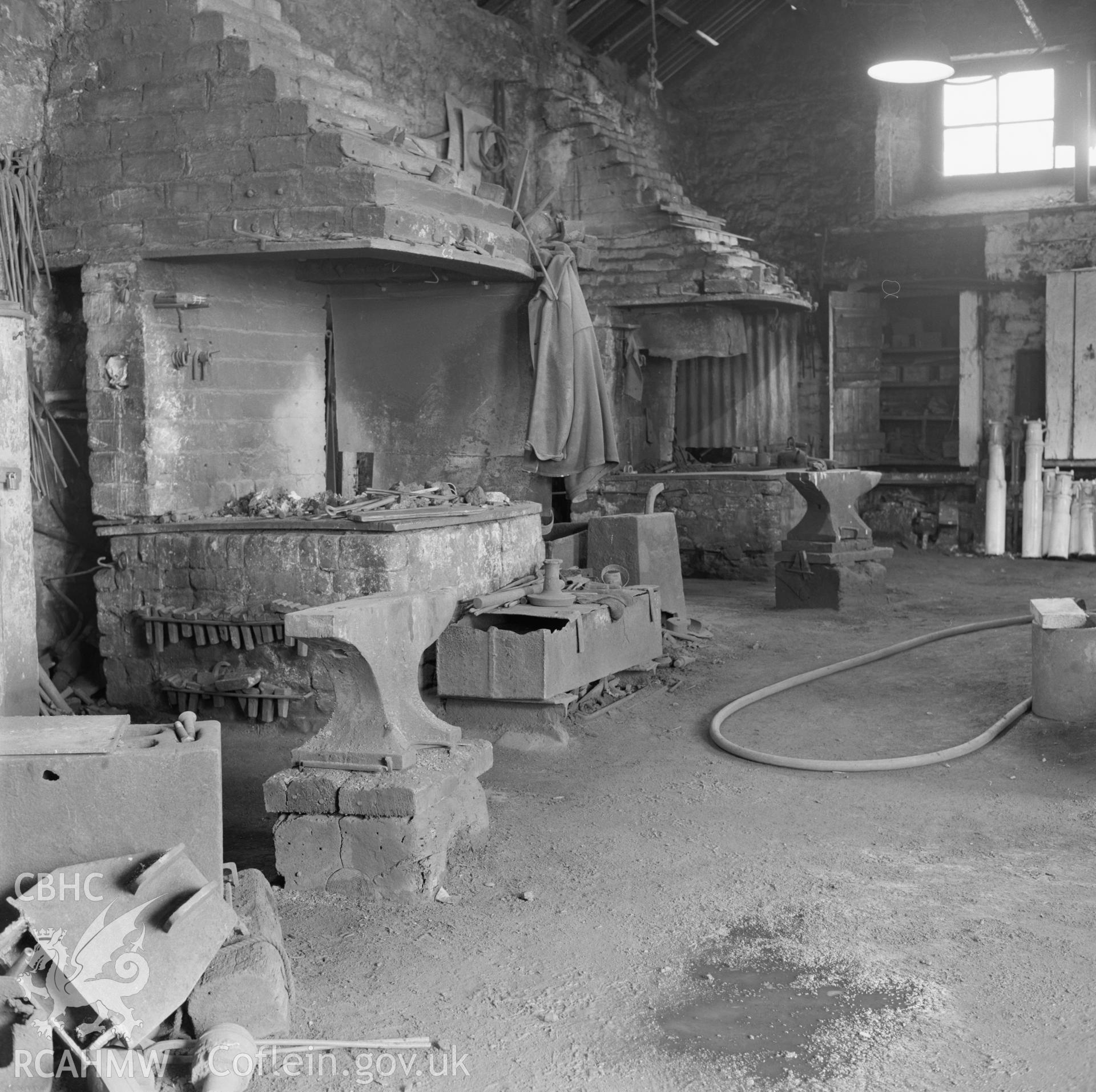 Digital copy of an acetate negative showing blacksmiths shop and forge at Big Pit, from the John Cornwell Collection.