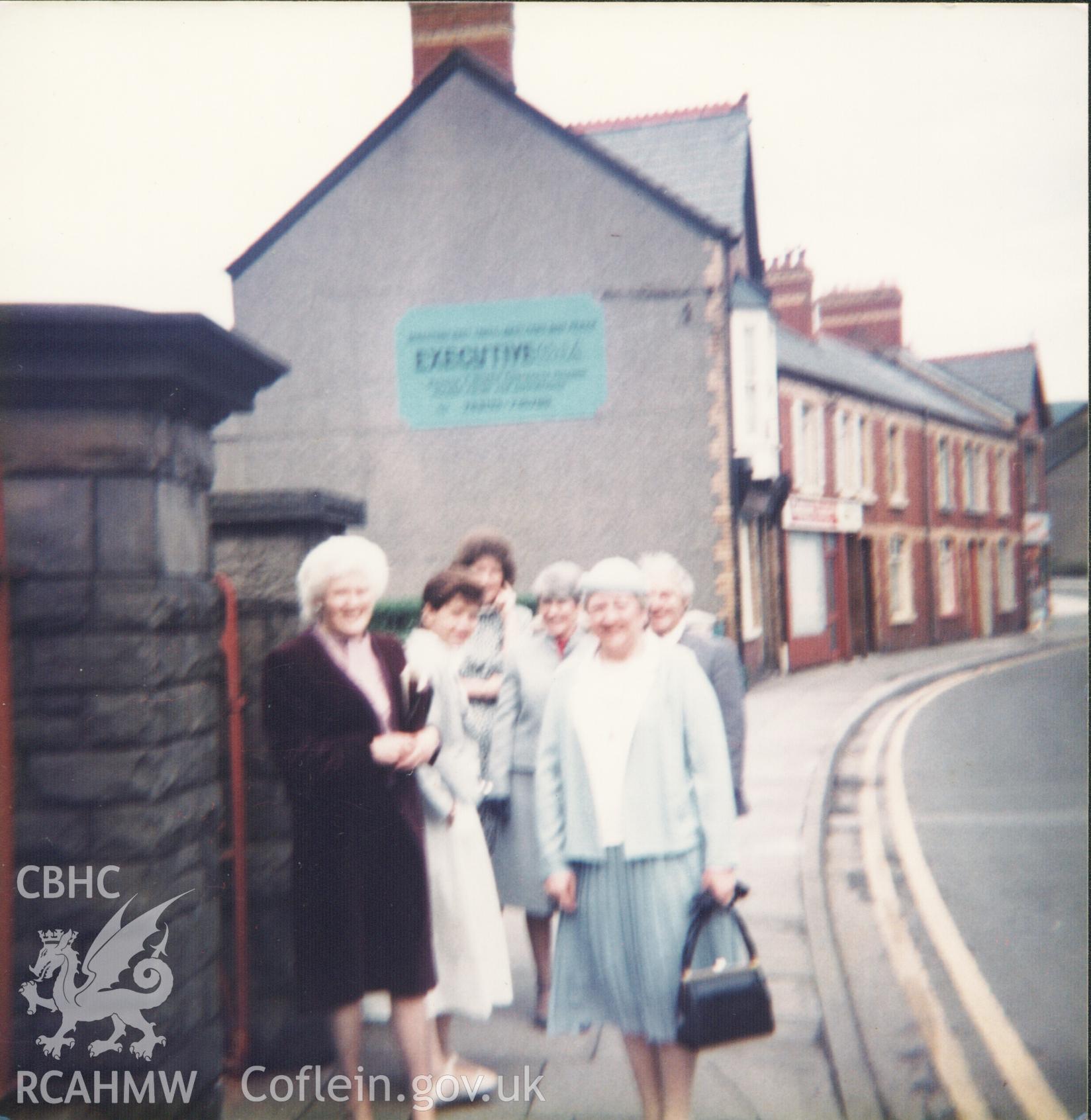 Colour photograph of members of Bethania chapel congregation on the way to chapel, 26th March 1985. Donated to the RCAHMW by Cyril Philips as part of the Digital Dissent Project.