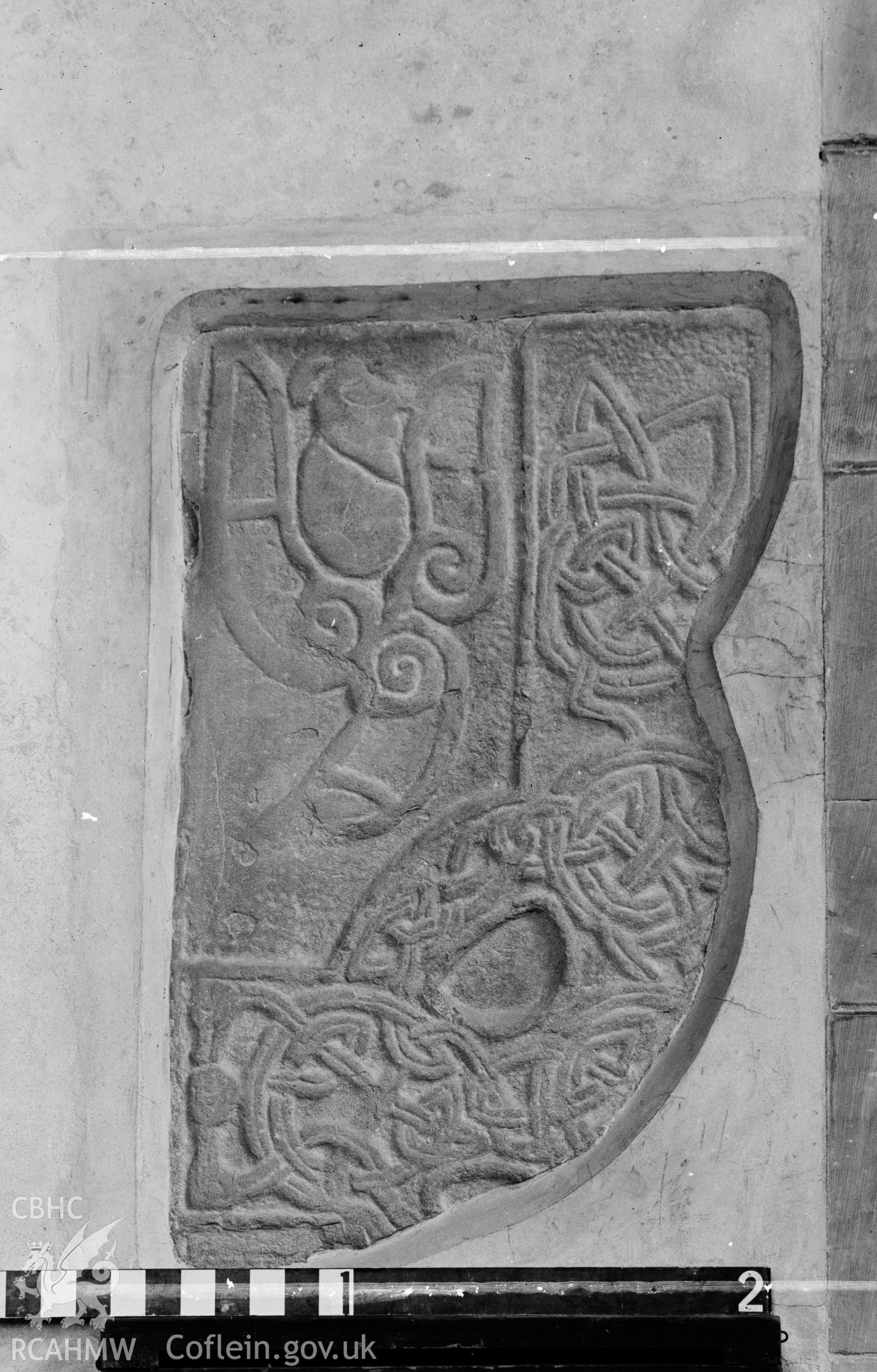 Digital copy of a black and white acetate negative showing detail of engraved stone wall insert at St. David's Cathedral, taken by E.W. Lovegrove, July 1936.