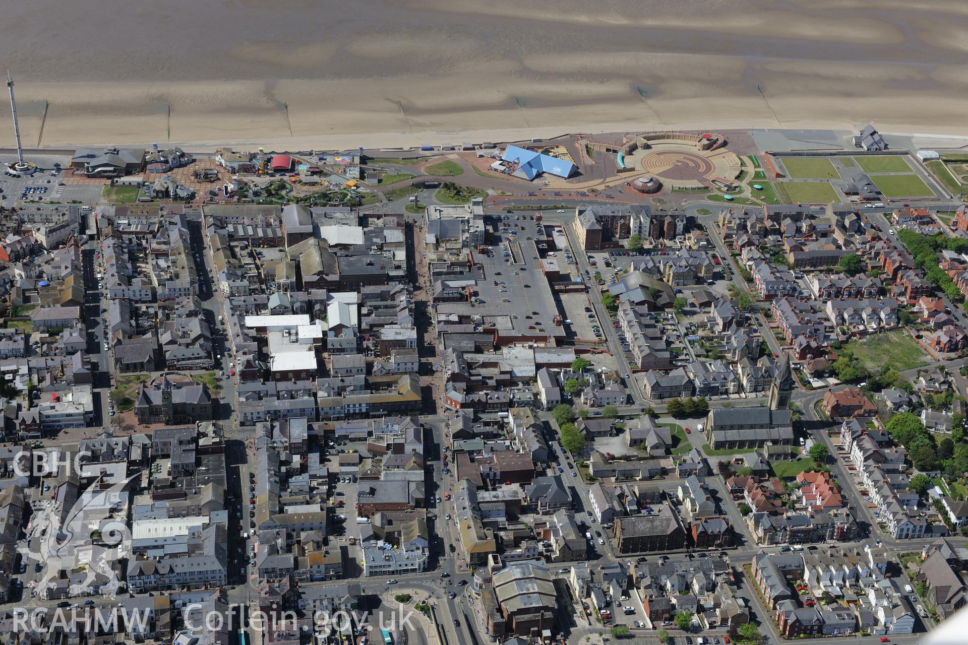 Rhyl and its promenade. Oblique aerial photograph taken during the Royal Commission?s programme of archaeological aerial reconnaissance by Toby Driver on 22nd May 2013.