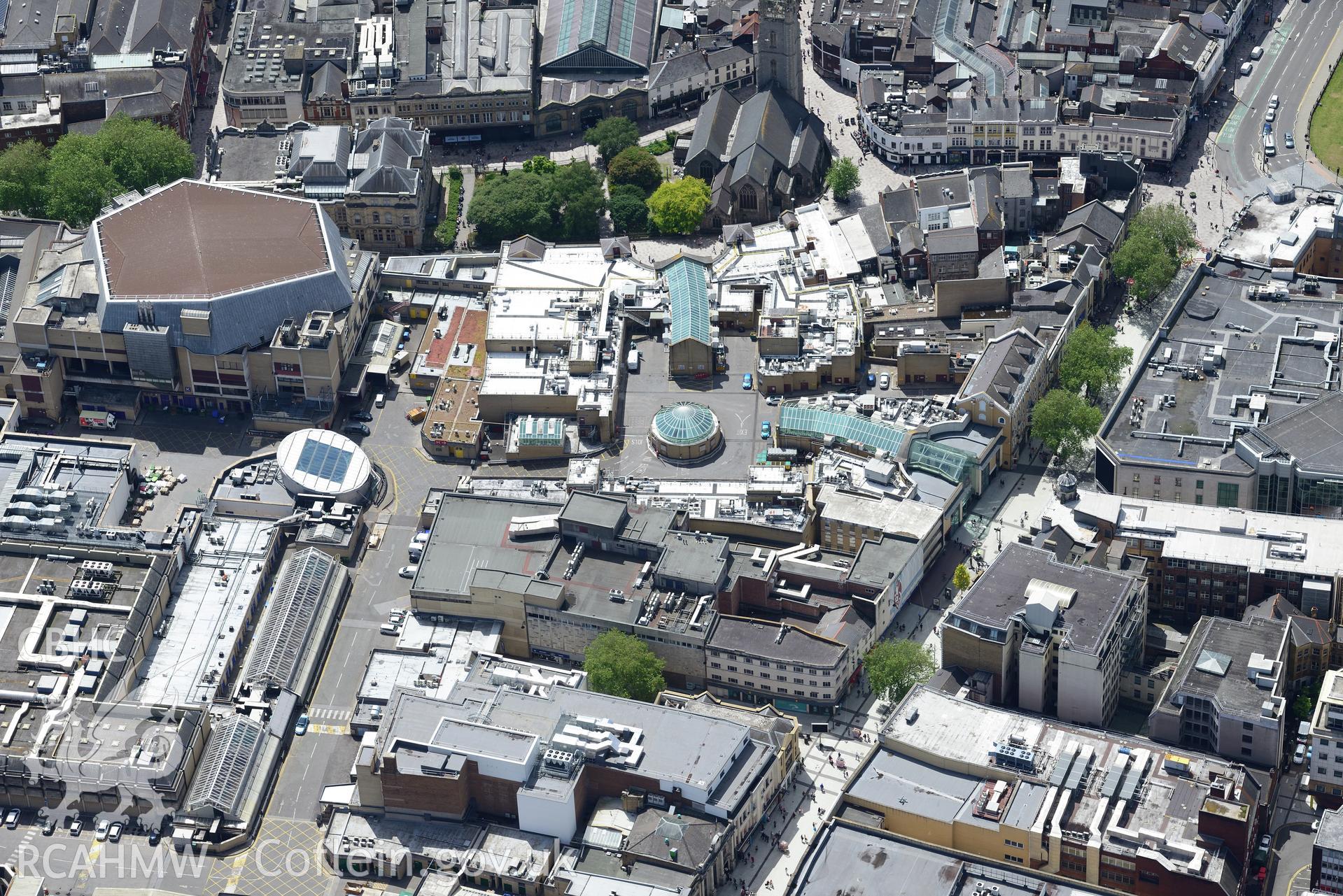 Cardiff Central Library; St. John the Baptist's Church and St. David's shopping centre, Cardiff. Oblique aerial photograph taken during the Royal Commission's programme of archaeological aerial reconnaissance by Toby Driver on 29th June 2015.