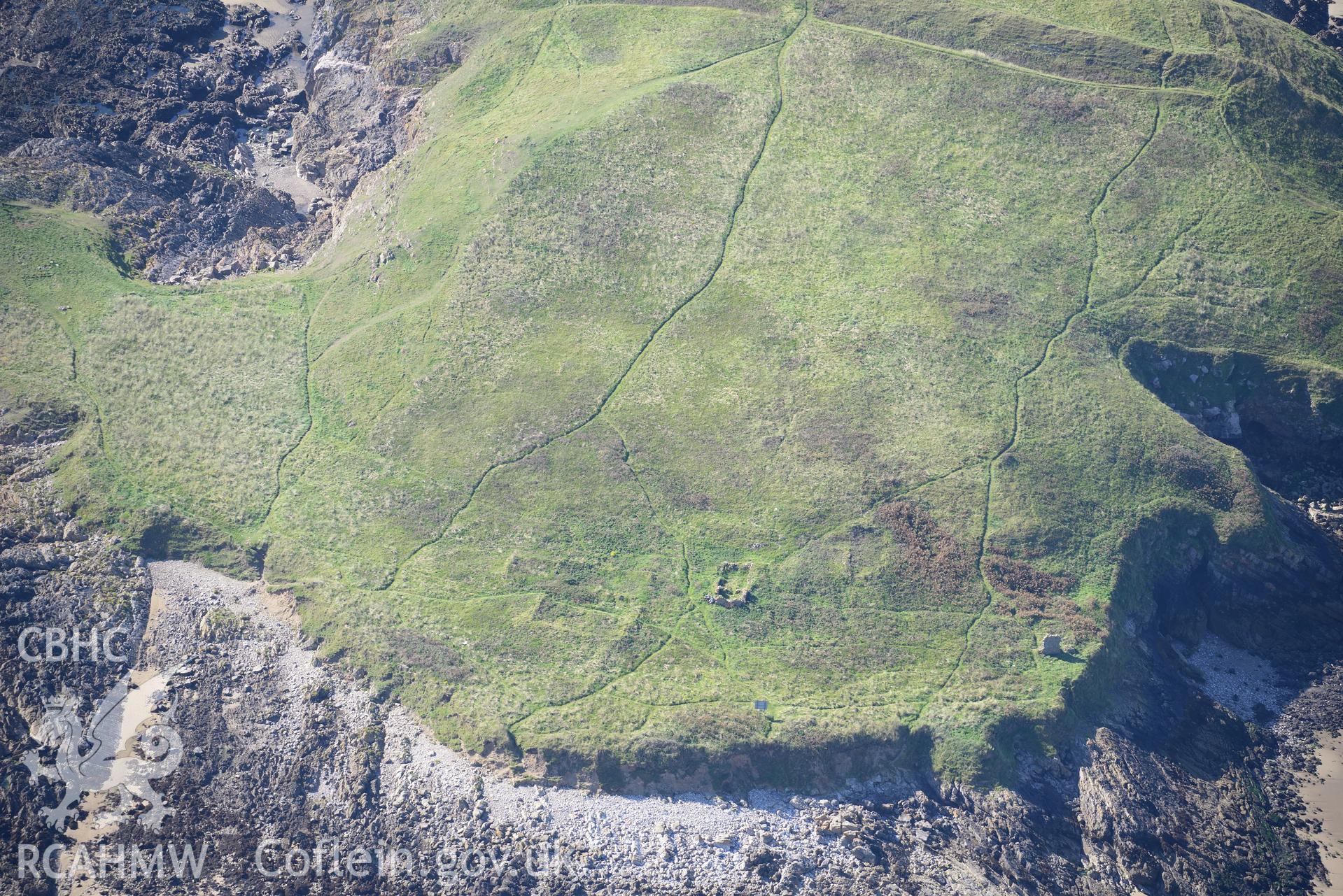 Burry Holms, with its medieval hermitage site, on the western coast of the Gower Peninsula. Oblique aerial photograph taken during the Royal Commission's programme of archaeological aerial reconnaissance by Toby Driver on 30th September 2015.