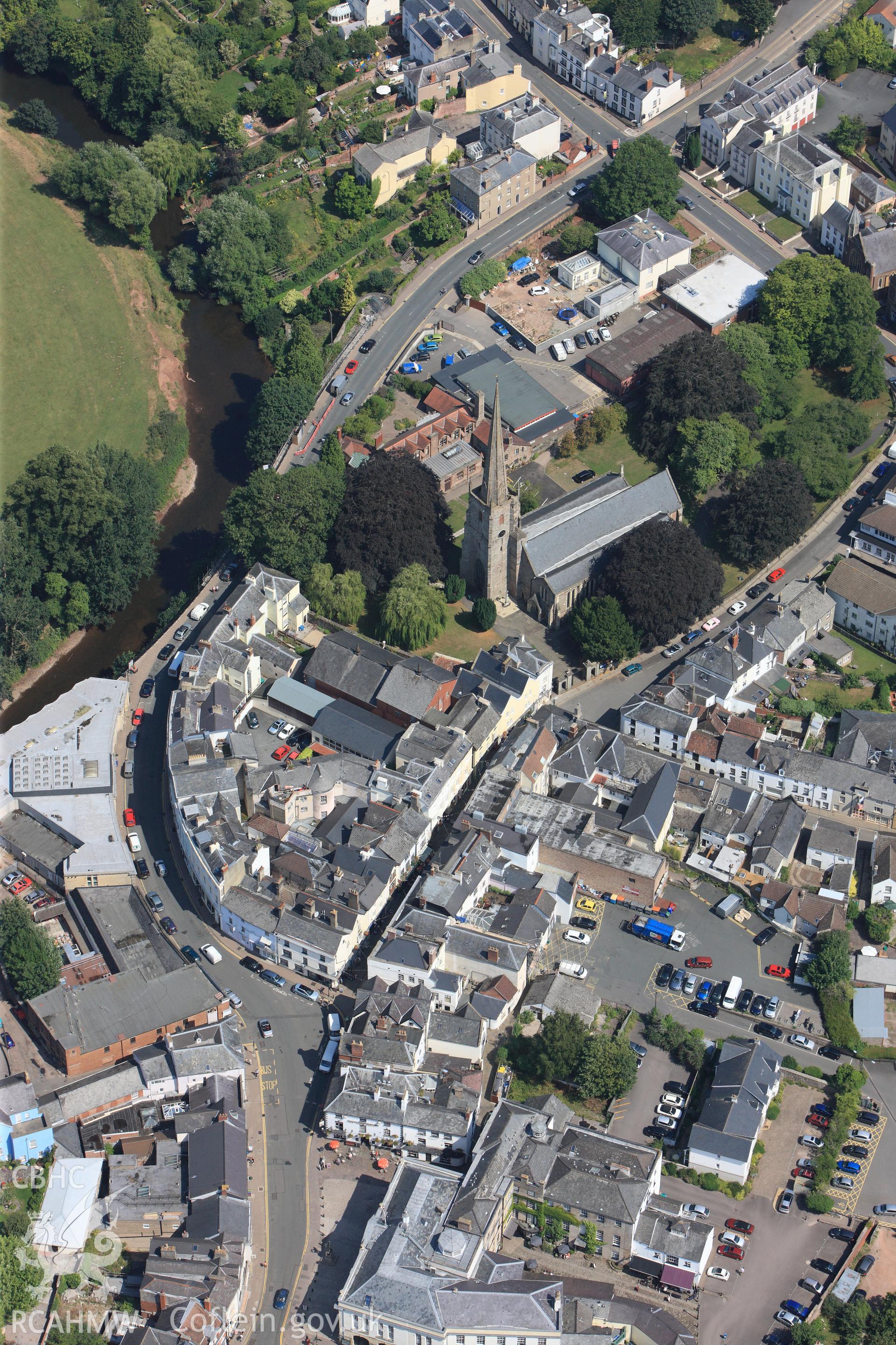 St. Mary the Virgin's church and the surrounding town of Monmouth. Oblique aerial photograph taken during the Royal Commission?s programme of archaeological aerial reconnaissance by Toby Driver on 1st August 2013.
