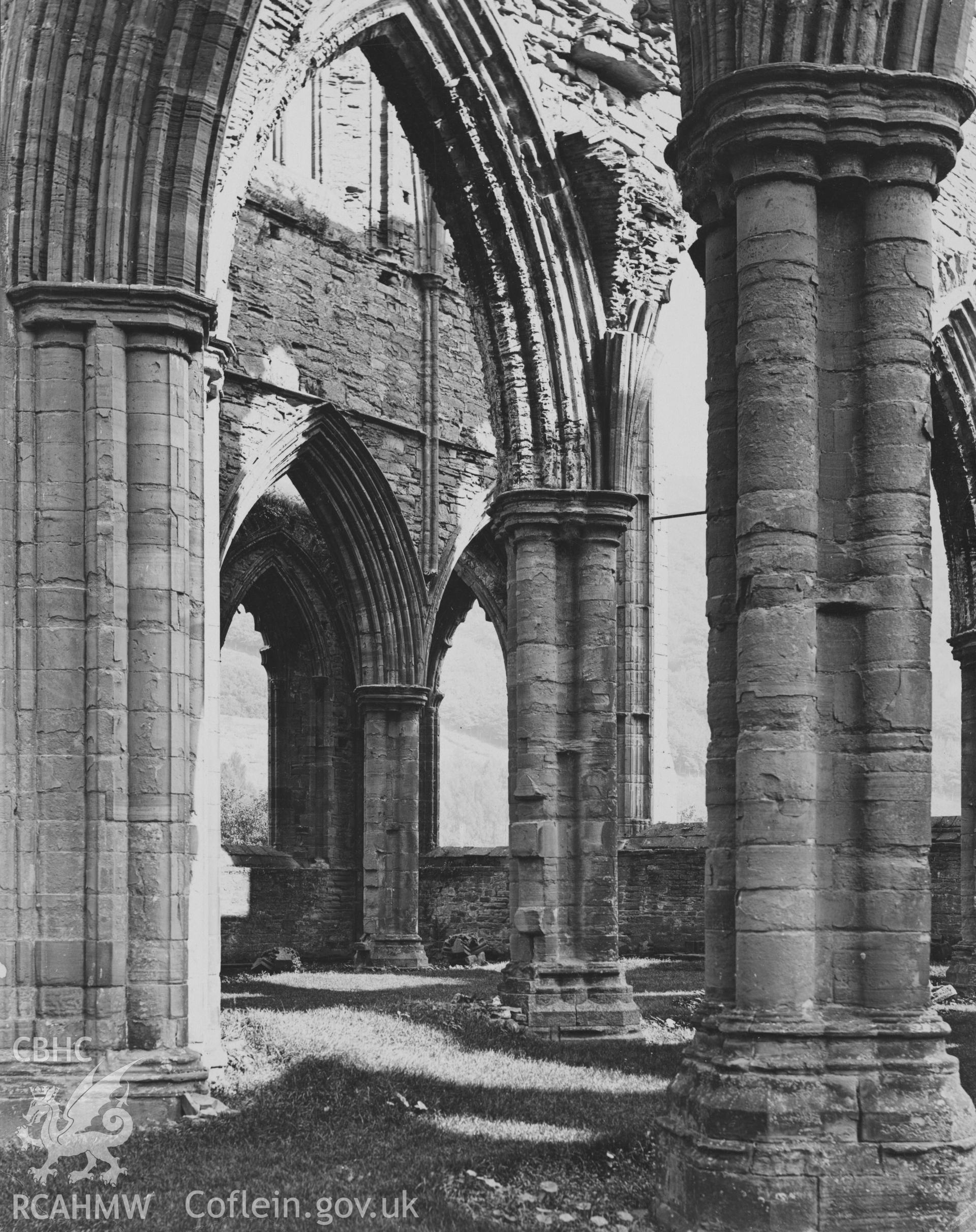 Digital copy of an early National Buildings Record photograph showing an interior view of the Presbytery at Tintern Abbey looking north-east.