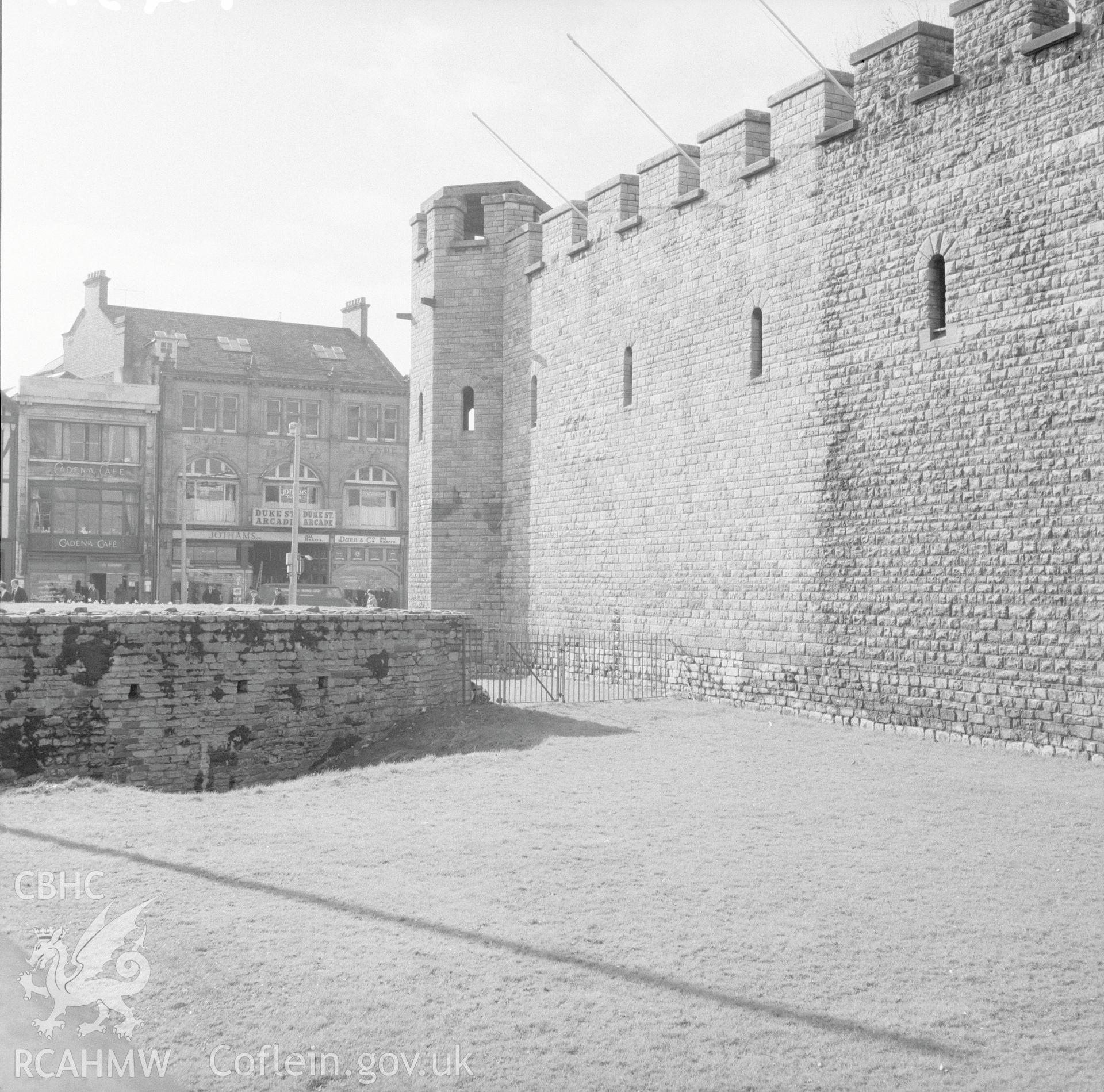 Digital copy of a black and white negative showing west wall of Cardiff Castle, taken 21st February 1966.