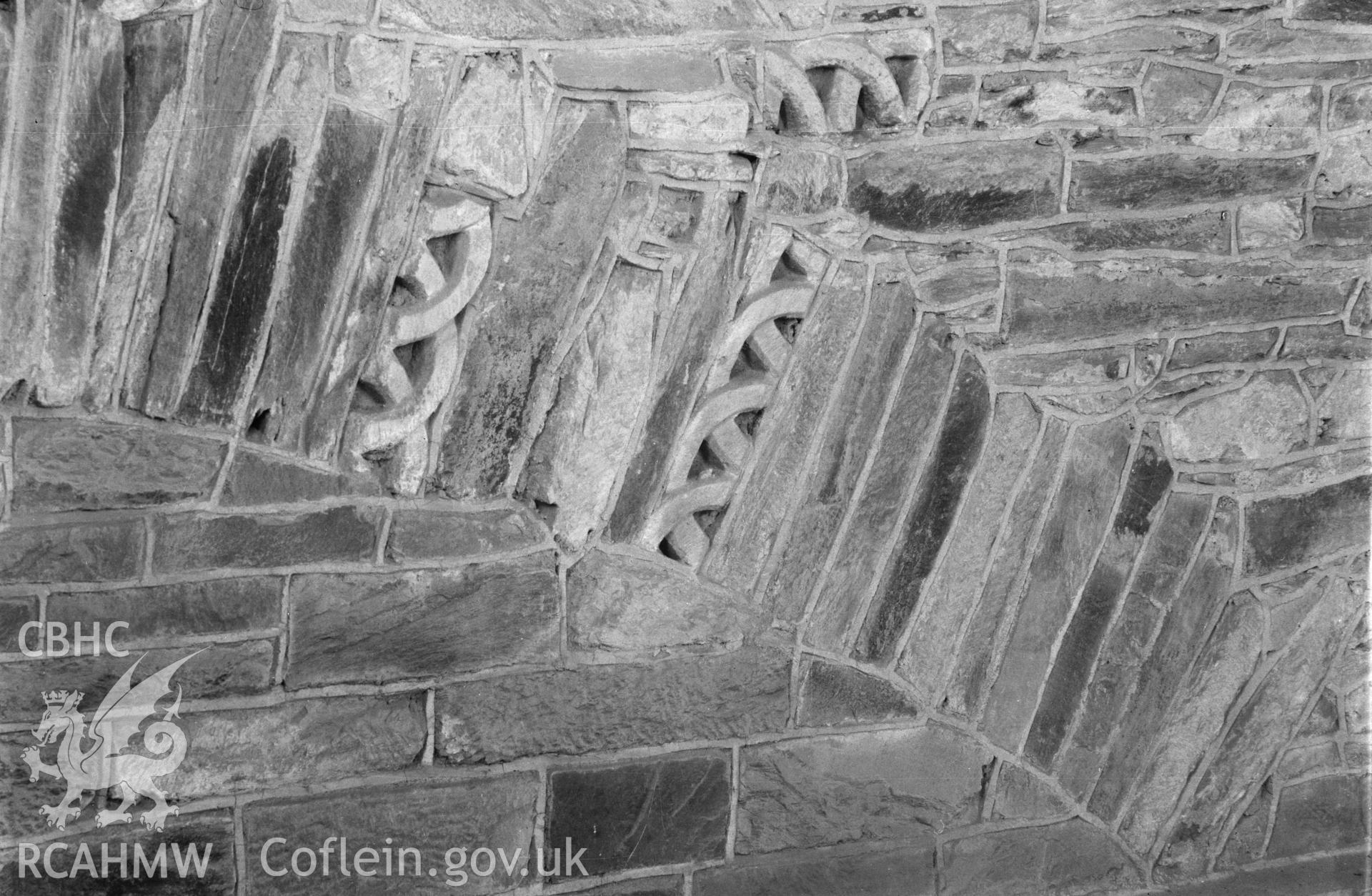 Digital copy of a black and white nitrate negative showing detailed view of stonework arch at St. David's Cathedral, taken by E.W. Lovegrove, July 1936.
