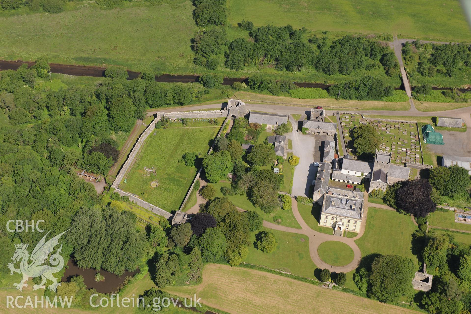 Ewenny Priory including views of the south and north gatehouses; Priory House; dovecote; north tower and St. Michael's church. Oblique aerial photograph taken during the Royal Commission's programme of archaeological aerial reconnaissance by Toby Driver on 19th June 2015.