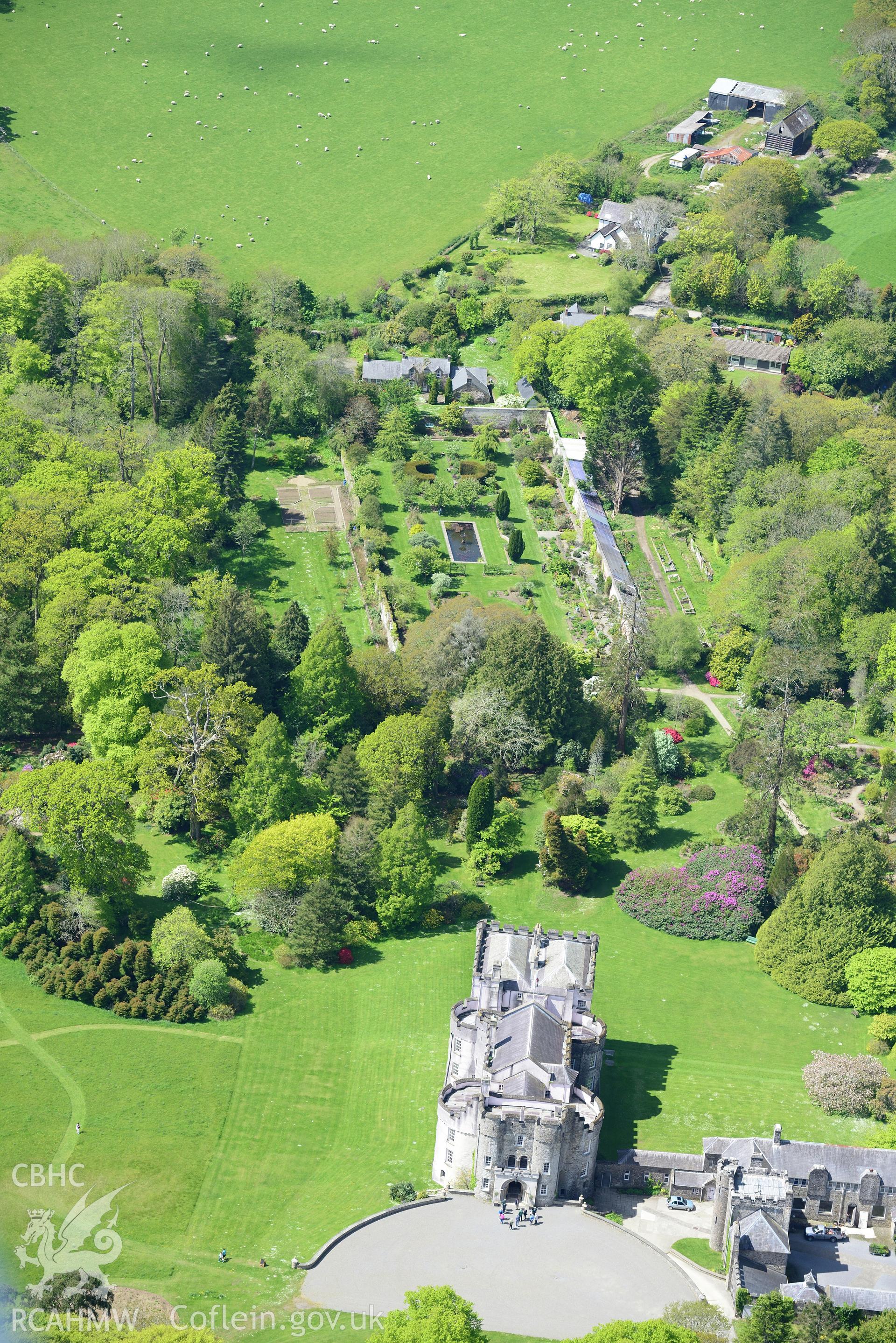 Picton Castle and gardens, Slebech. Oblique aerial photograph taken during the Royal Commission's programme of archaeological aerial reconnaissance by Toby Driver on 13th May 2015.