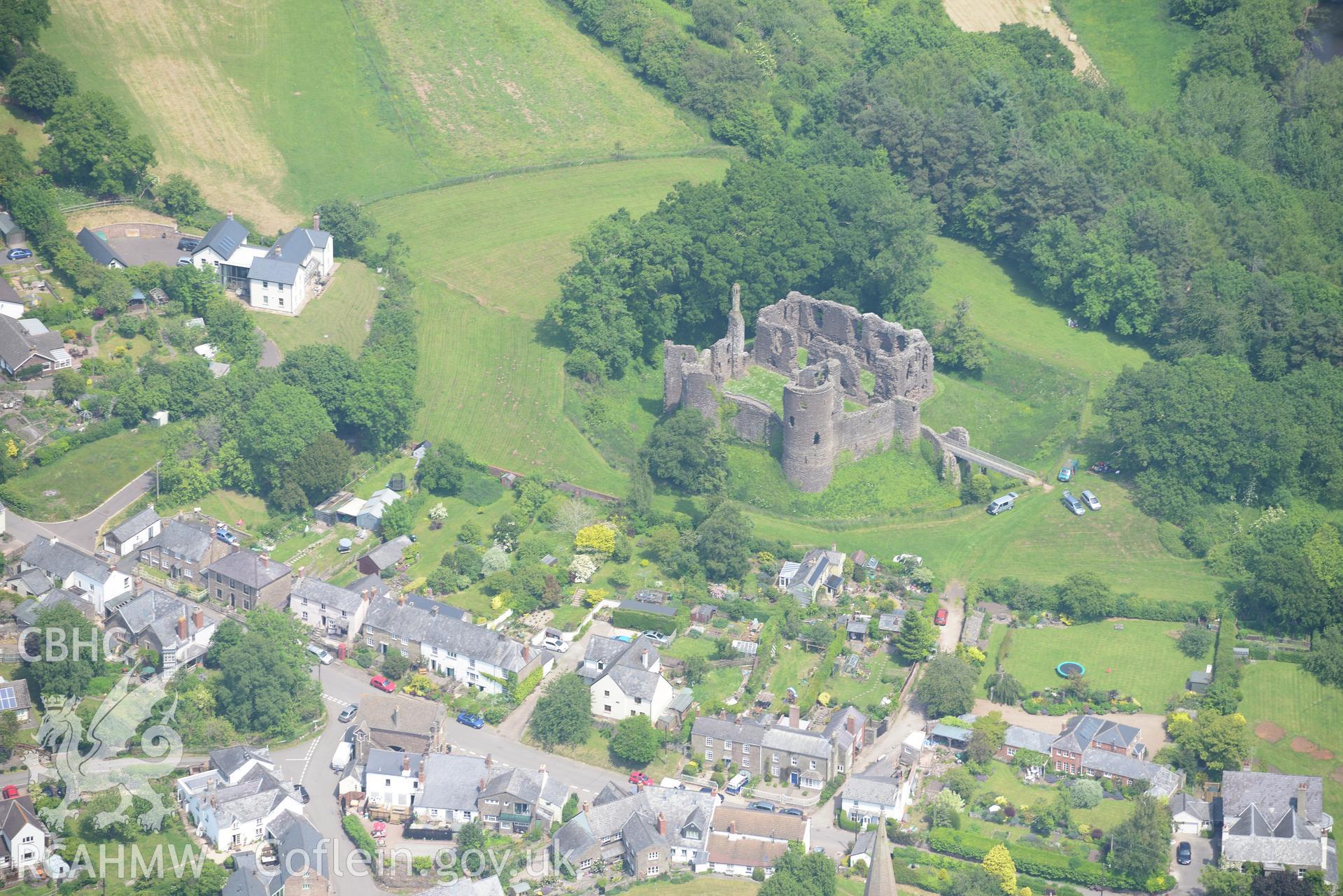 Grosmont village including view of the castle. Oblique aerial photograph taken during the Royal Commission's programme of archaeological aerial reconnaissance by Toby Driver on 11th June 2015.