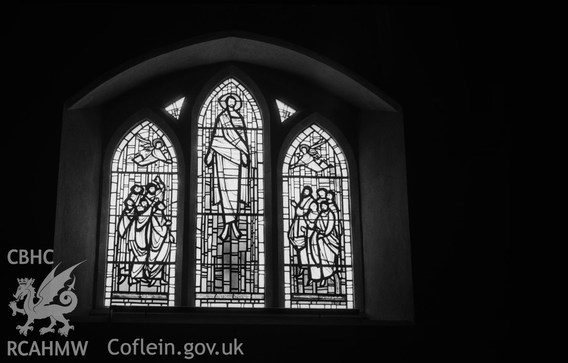 Digital copy of a black and white negative showing stained glass window to Stanley Johnson by Roy Lewis, 1962, in south wall of nave at St. Michael's church, Llandre. Photographed in April 1963 by Arthur O. Chater.