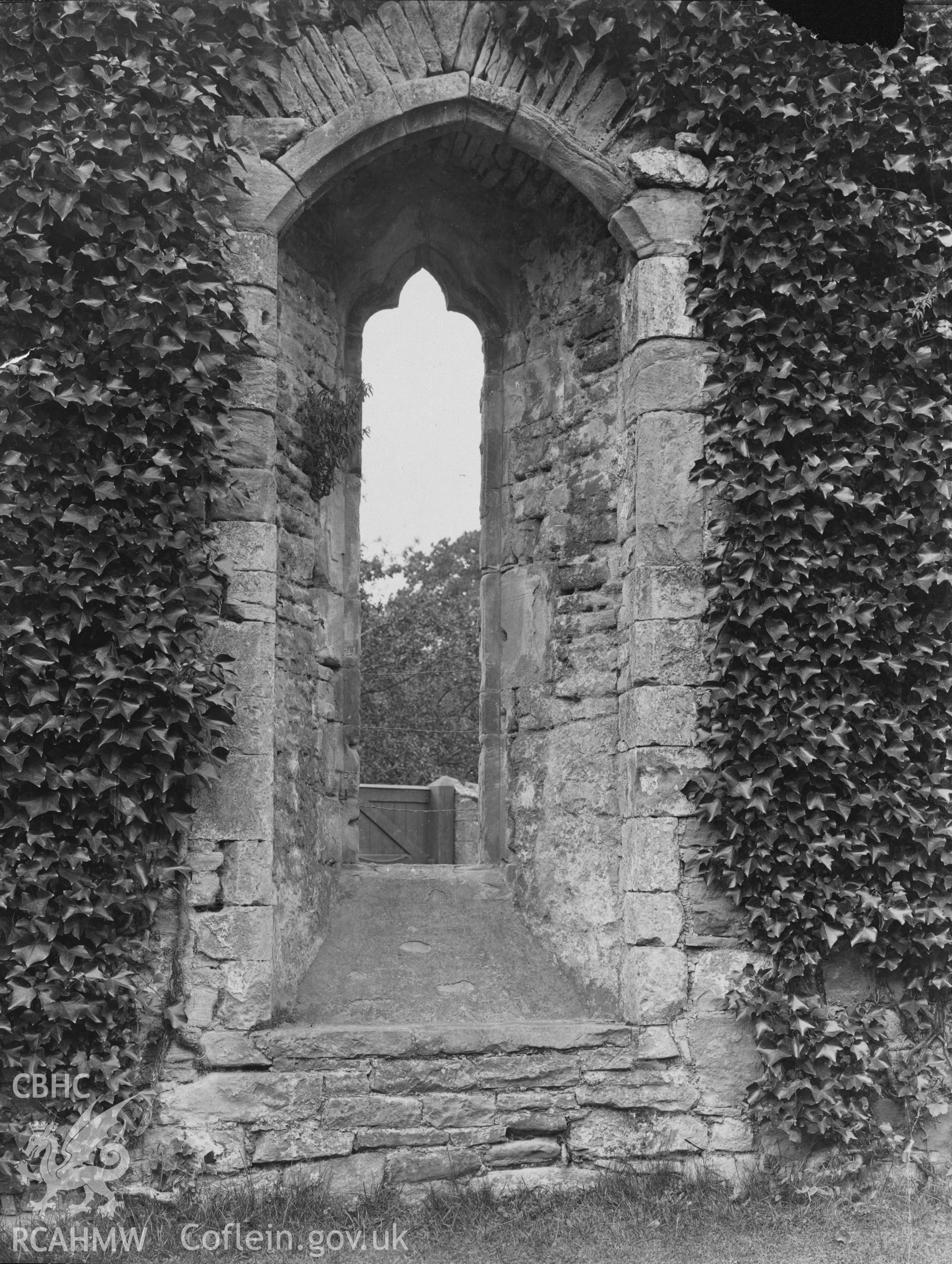 Digital copy of an early National Buildings Record photograph showing the west window at Tintern Abbey.