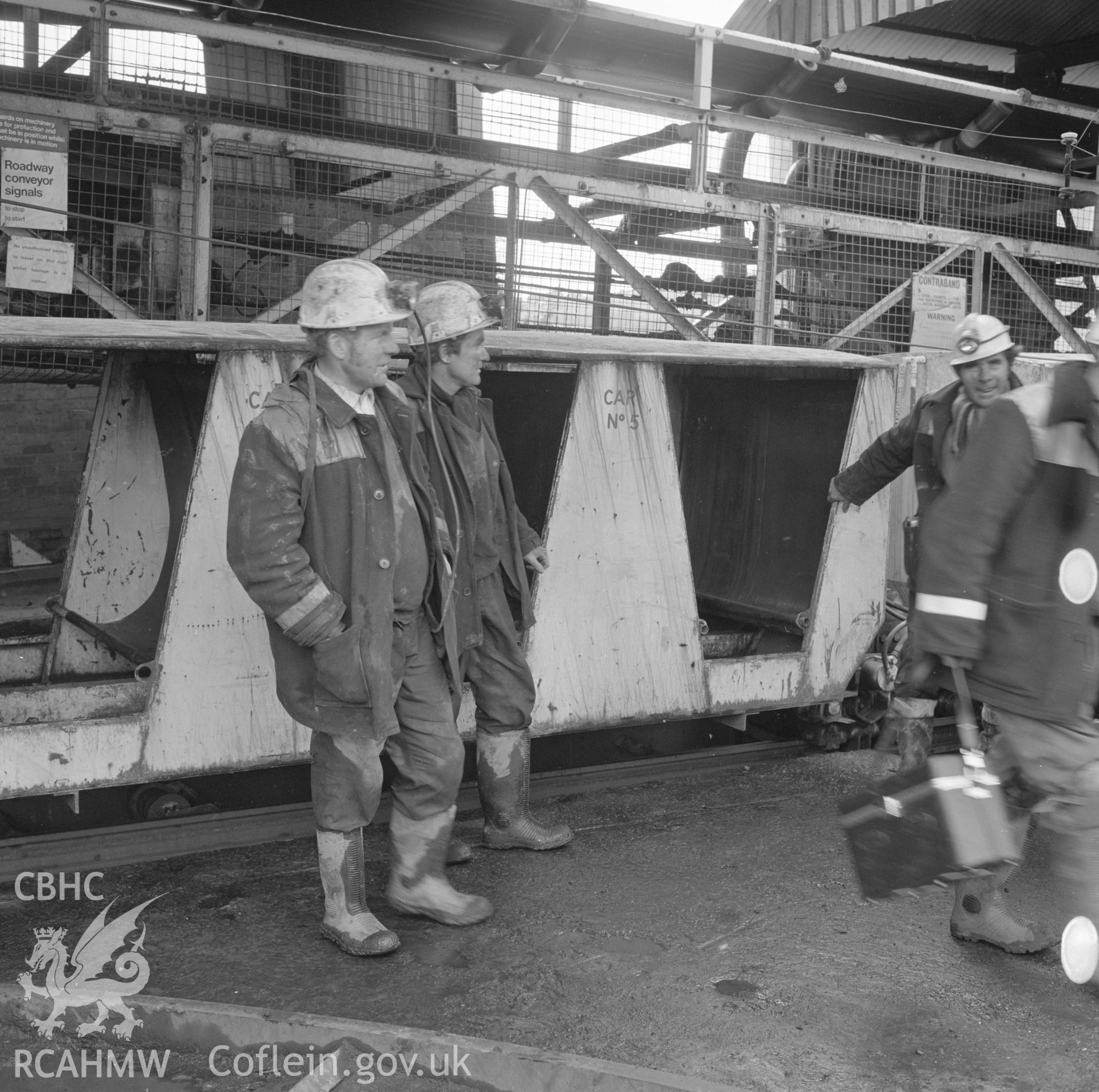 Digital copy of an acetate negative showing men boarding man-rider at Blaenant Colliery, from the John Cornwell Collection.