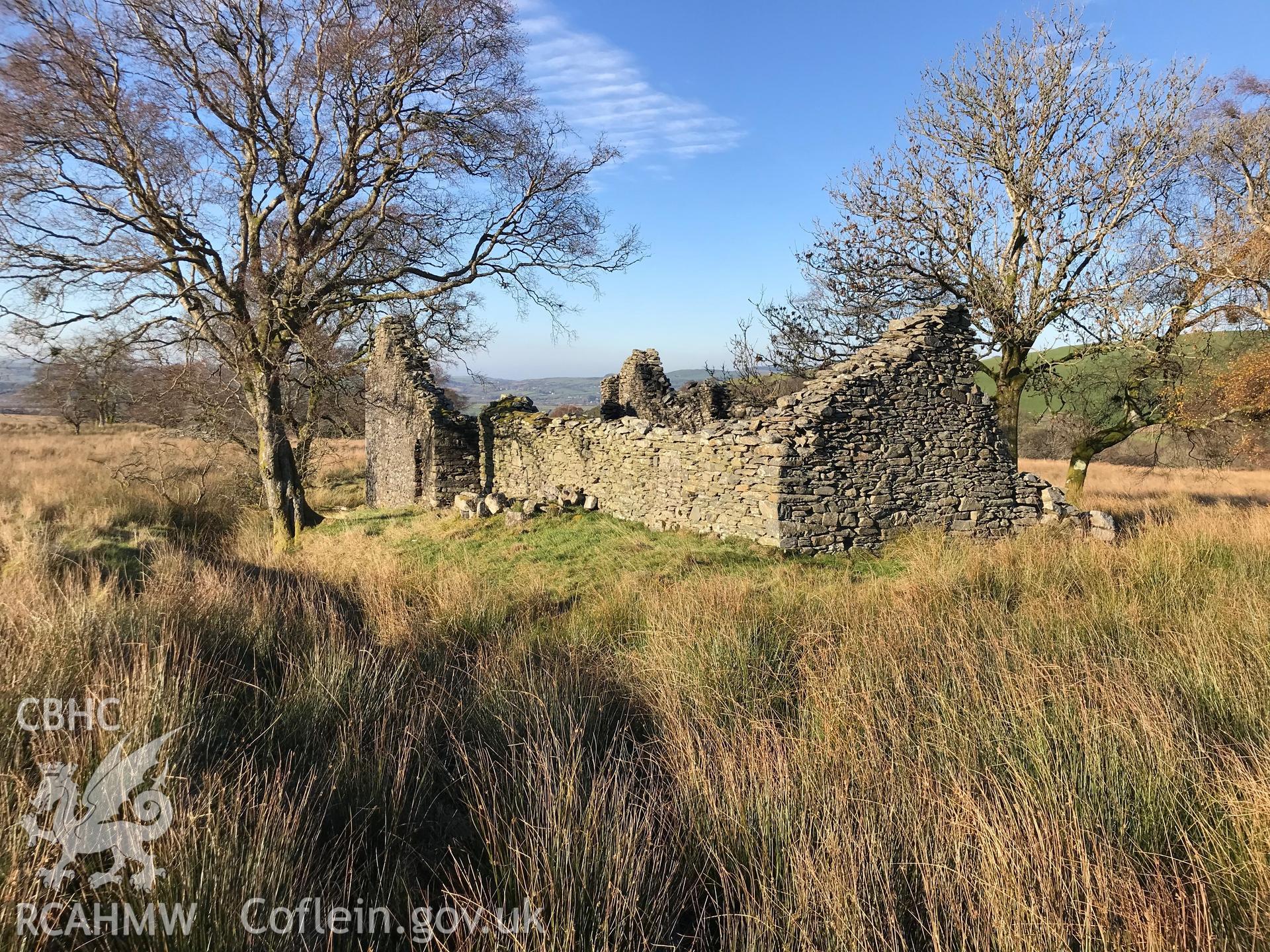 Exterior view of the remains of the drystone walled Pen-Cwm house, south west of Bryneithinog farm, Ystrad Fflur. Colour photograph taken by Paul R. Davis on 18th November 2018.
