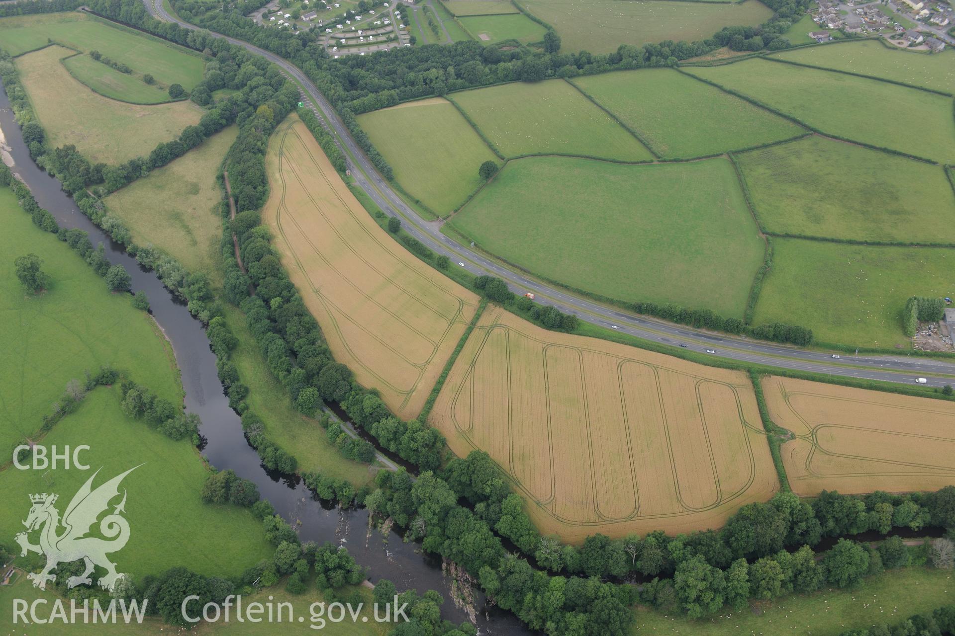 Cefn-brynich Roman fort, general view of cropmarks from south-east, taken by RCAHMW 1st August 2013.