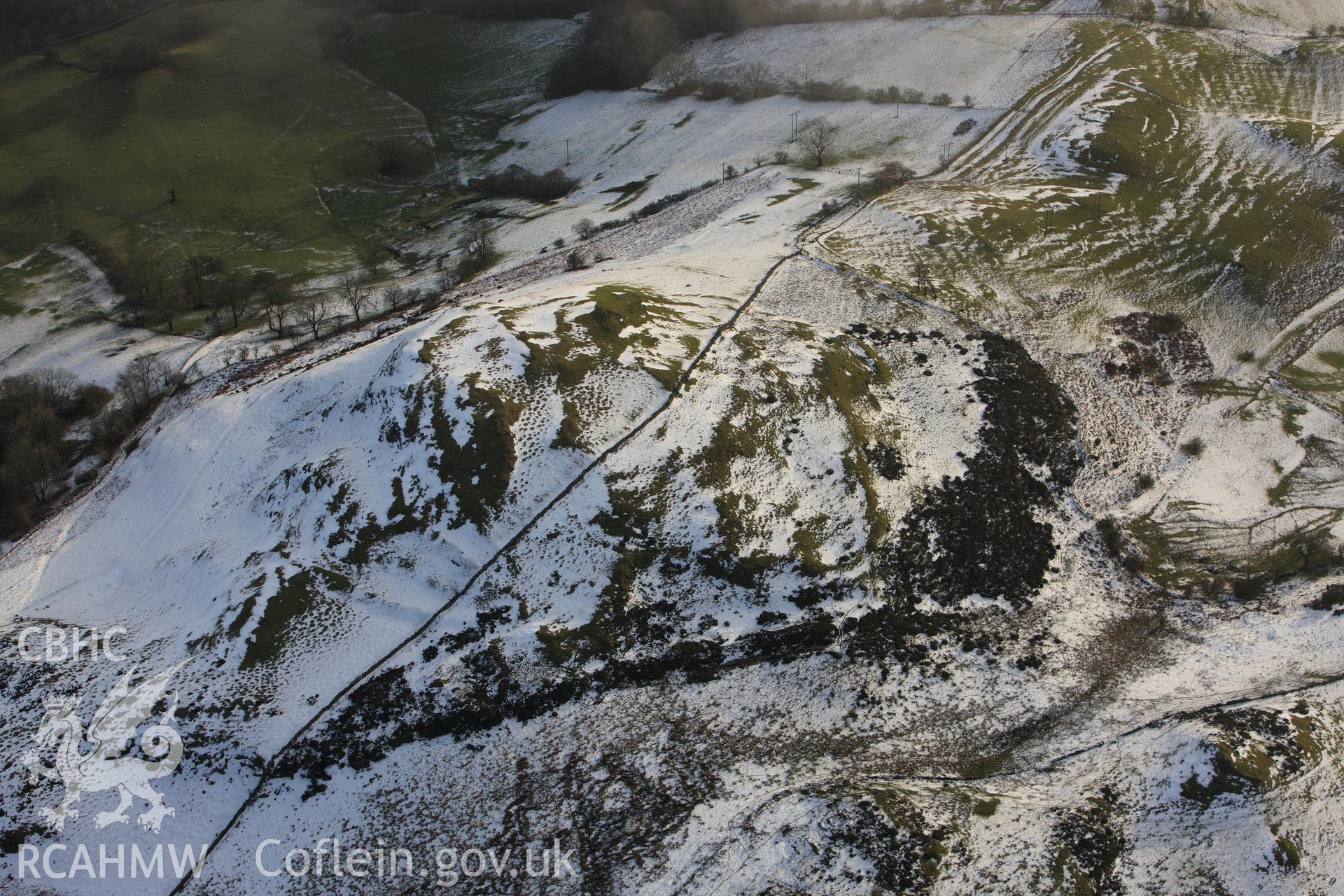 RCAHMW colour oblique photograph of Gaer Fawr hillfort, with melting snow. Taken by Toby Driver on 18/12/2011.