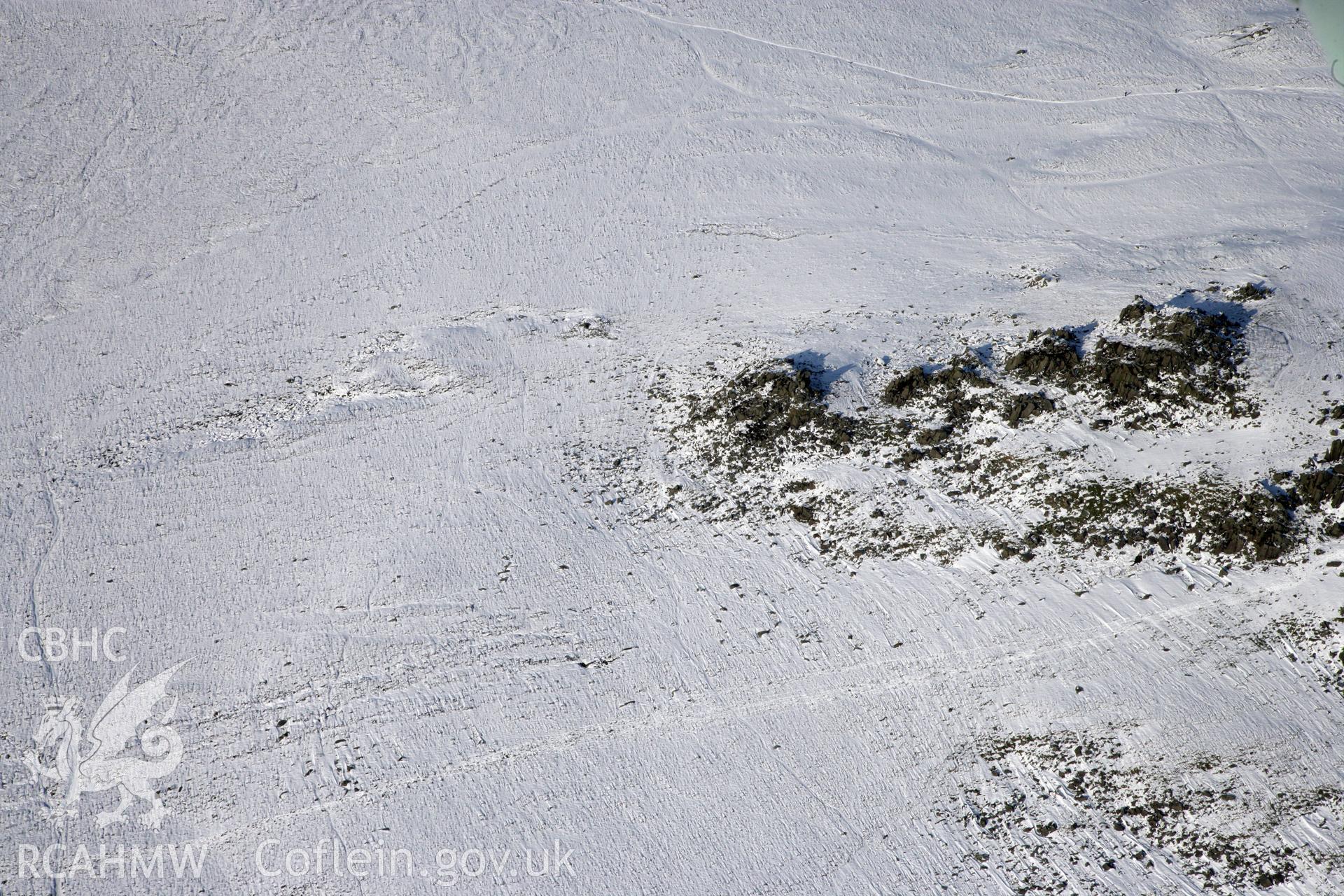 RCAHMW colour oblique photograph of Carn Meini Chambered Cairn. Taken by Toby Driver on 02/02/2012.