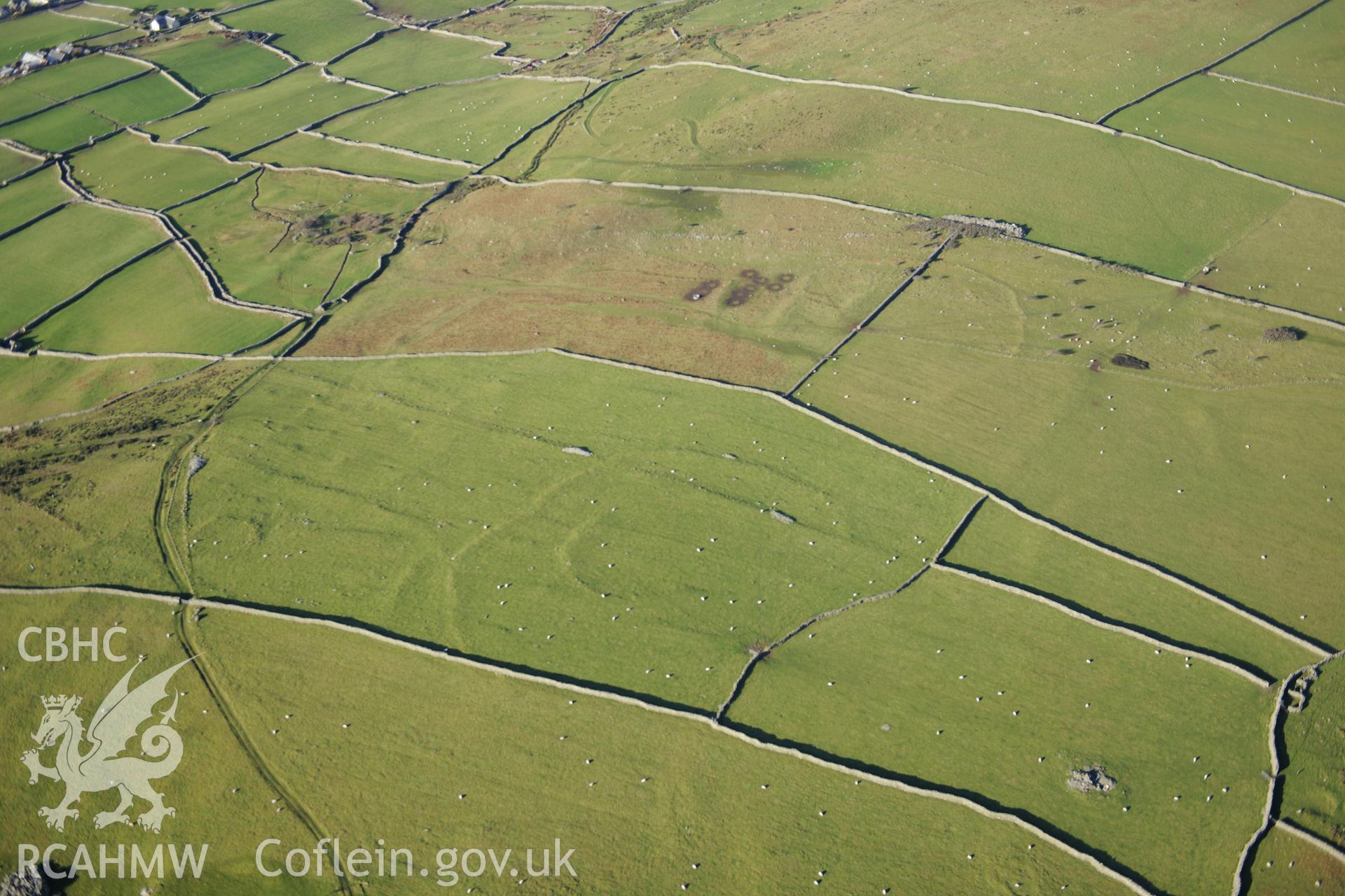 RCAHMW colour oblique photograph of Hendre Coed Uchaf concentric enclosures. Taken by Toby Driver on 10/12/2012.