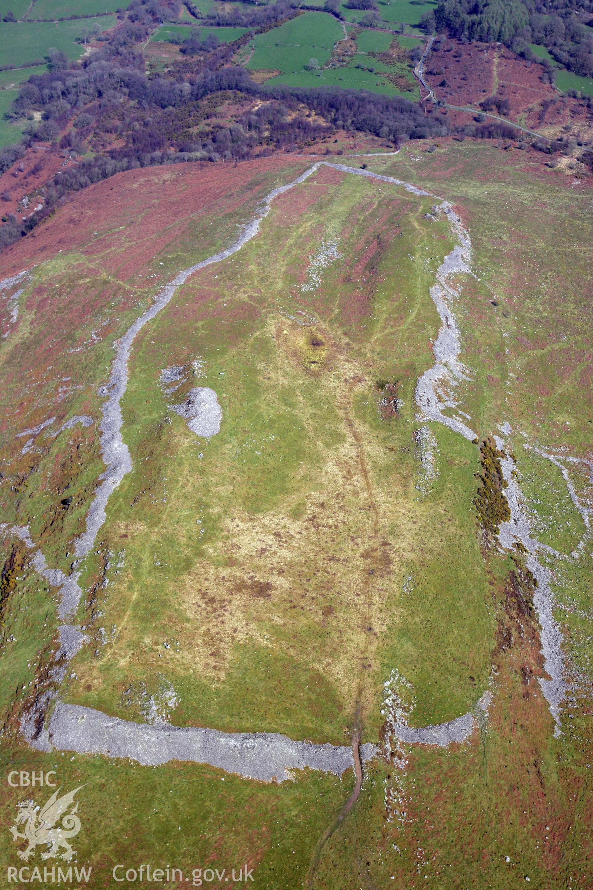 RCAHMW colour oblique photograph of Y Gaer Fawr, hillfort on Carn Goch, general view from south-west. Taken by Toby Driver and Oliver Davies on 28/03/2012.