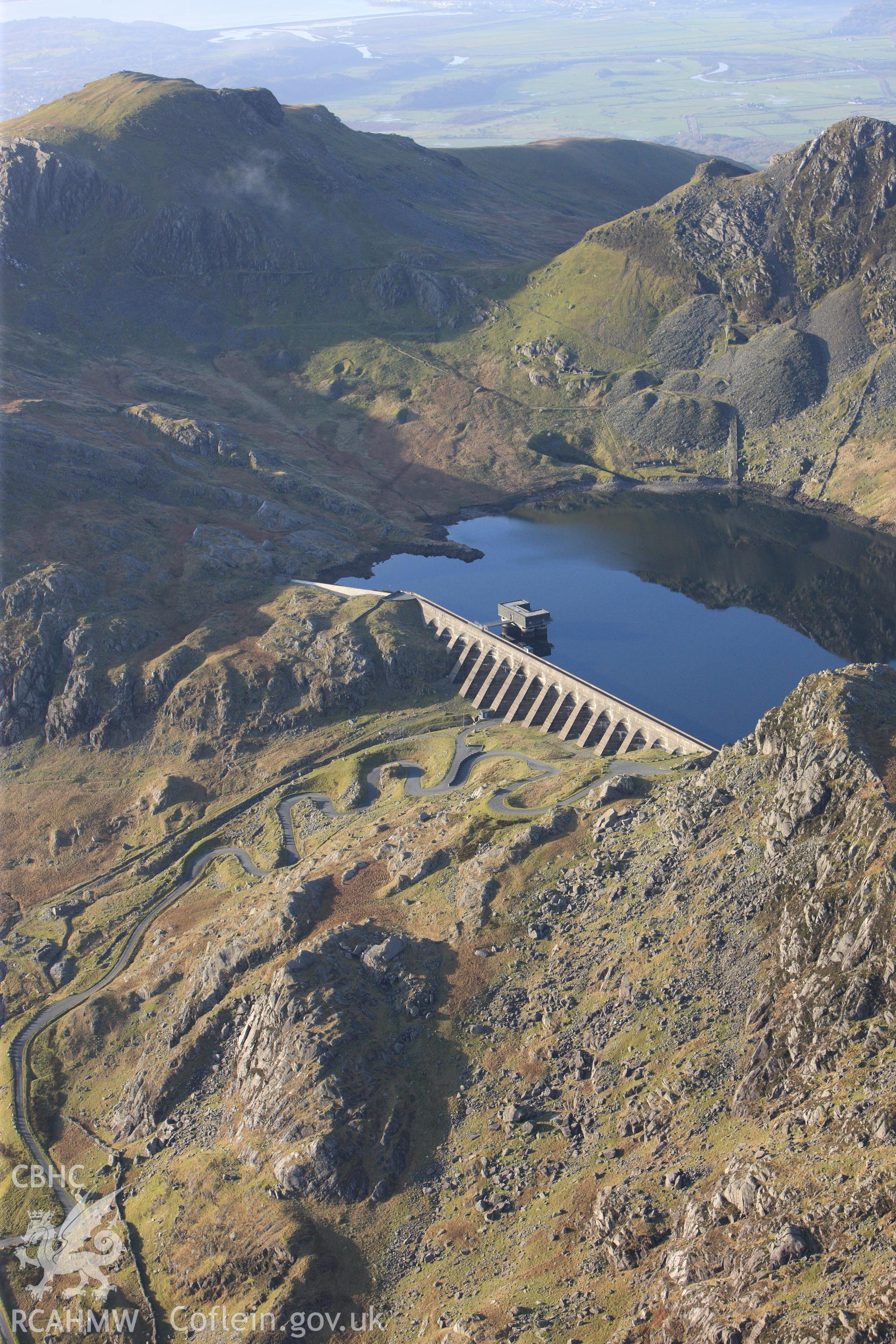 RCAHMW colour oblique photograph of Llyn Stwlan reservoir, with Moelwyn slate quarry. Taken by Toby Driver on 13/01/2012.
