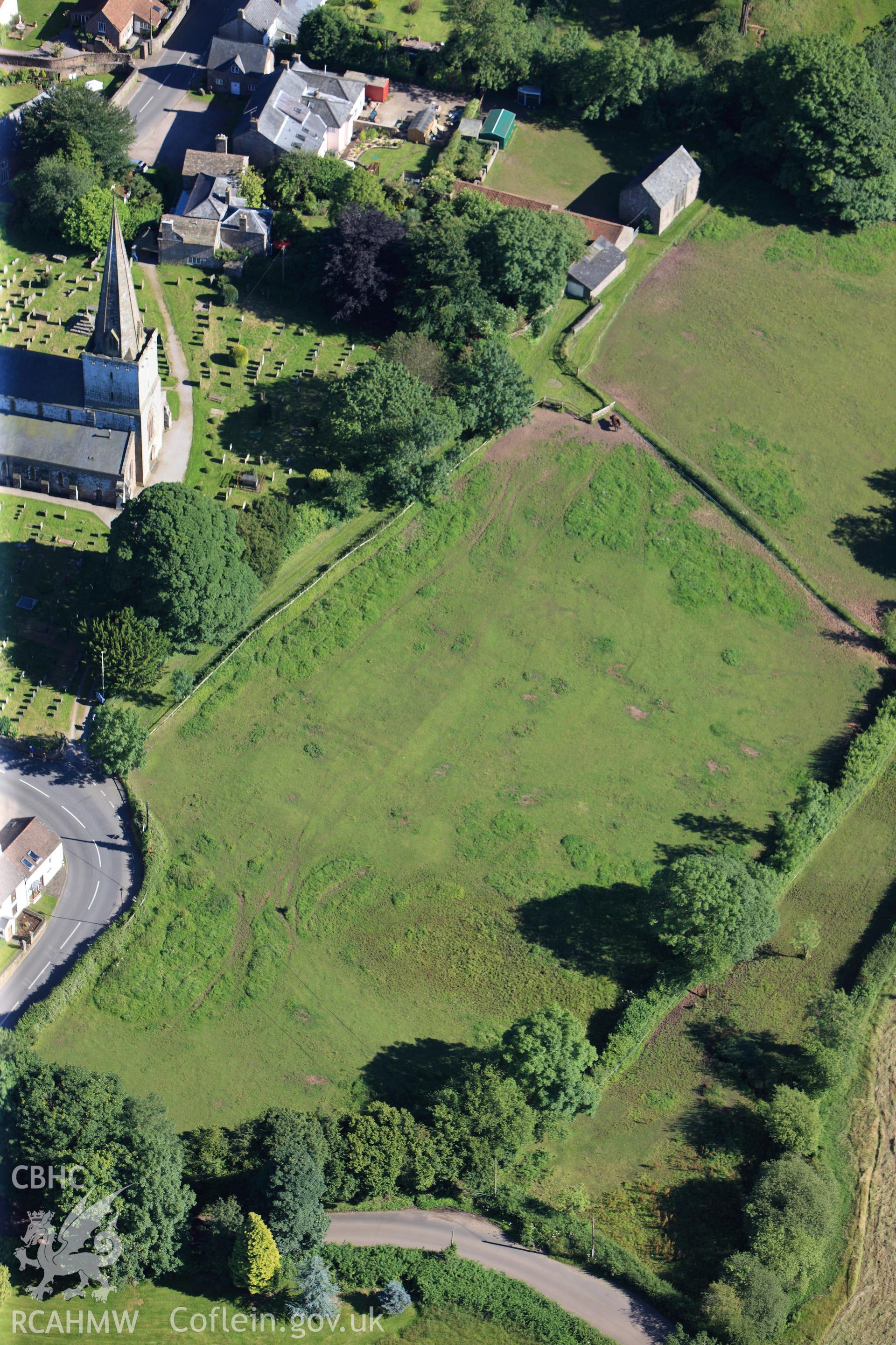 RCAHMW colour oblique photograph of Medieval house sites west of Trellech Church. Taken by Toby Driver on 24/07/2012.