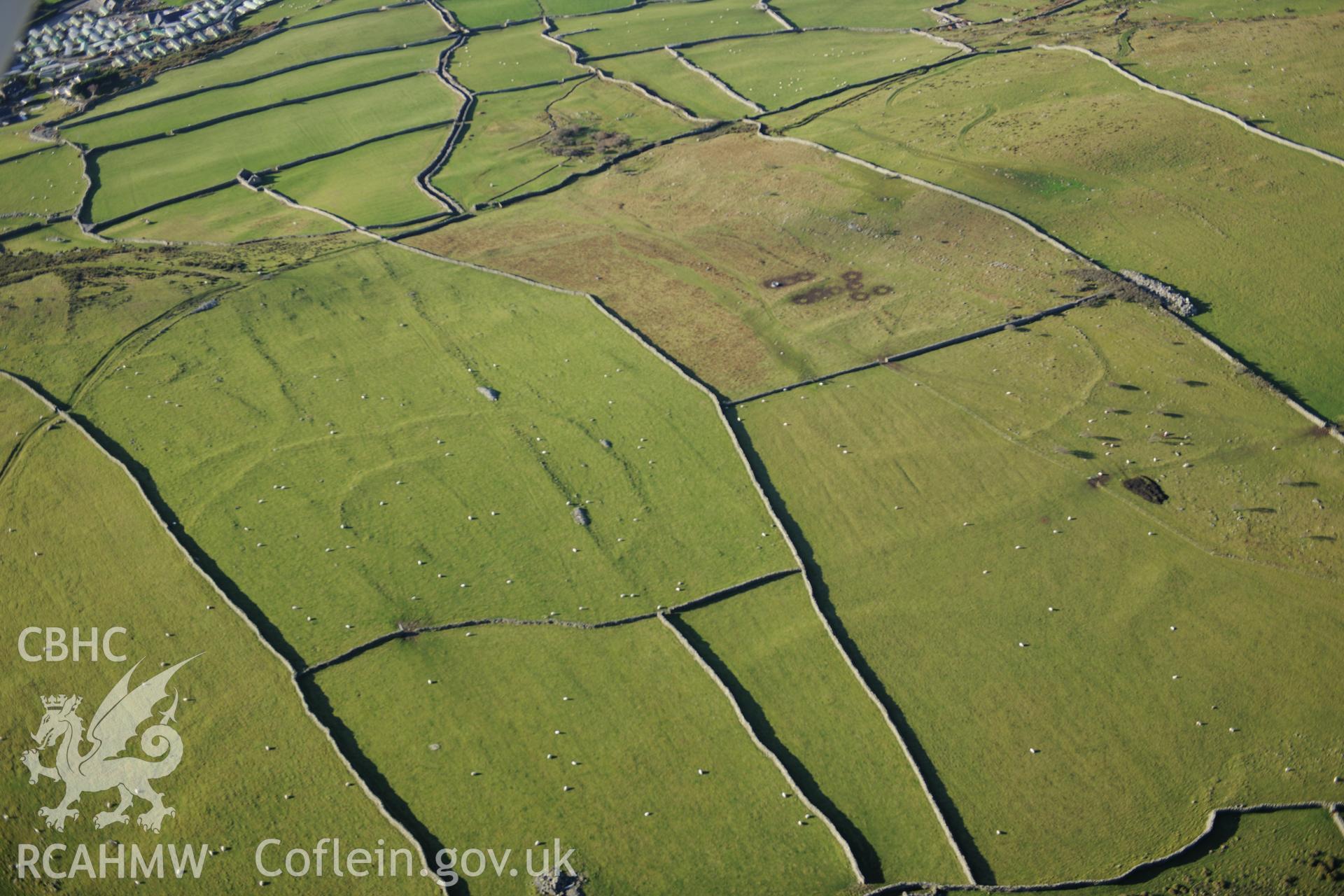 RCAHMW colour oblique photograph of Hendre Coed Uchaf concentric enclosures. Taken by Toby Driver on 10/12/2012.