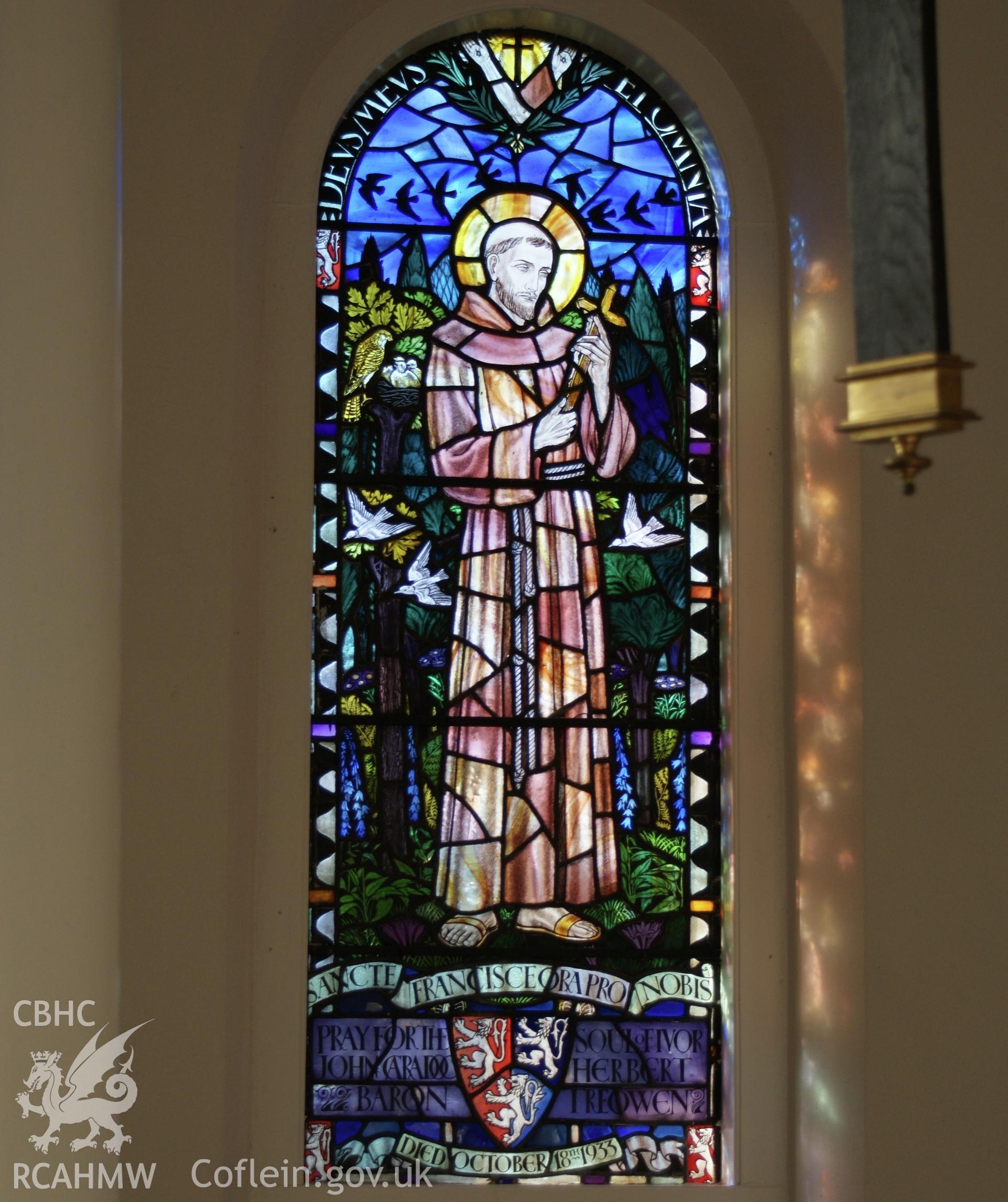 Digital colour photograph showing stained glass depicting St Francis at St Mary and St Michael Catholic church, Llanarth.