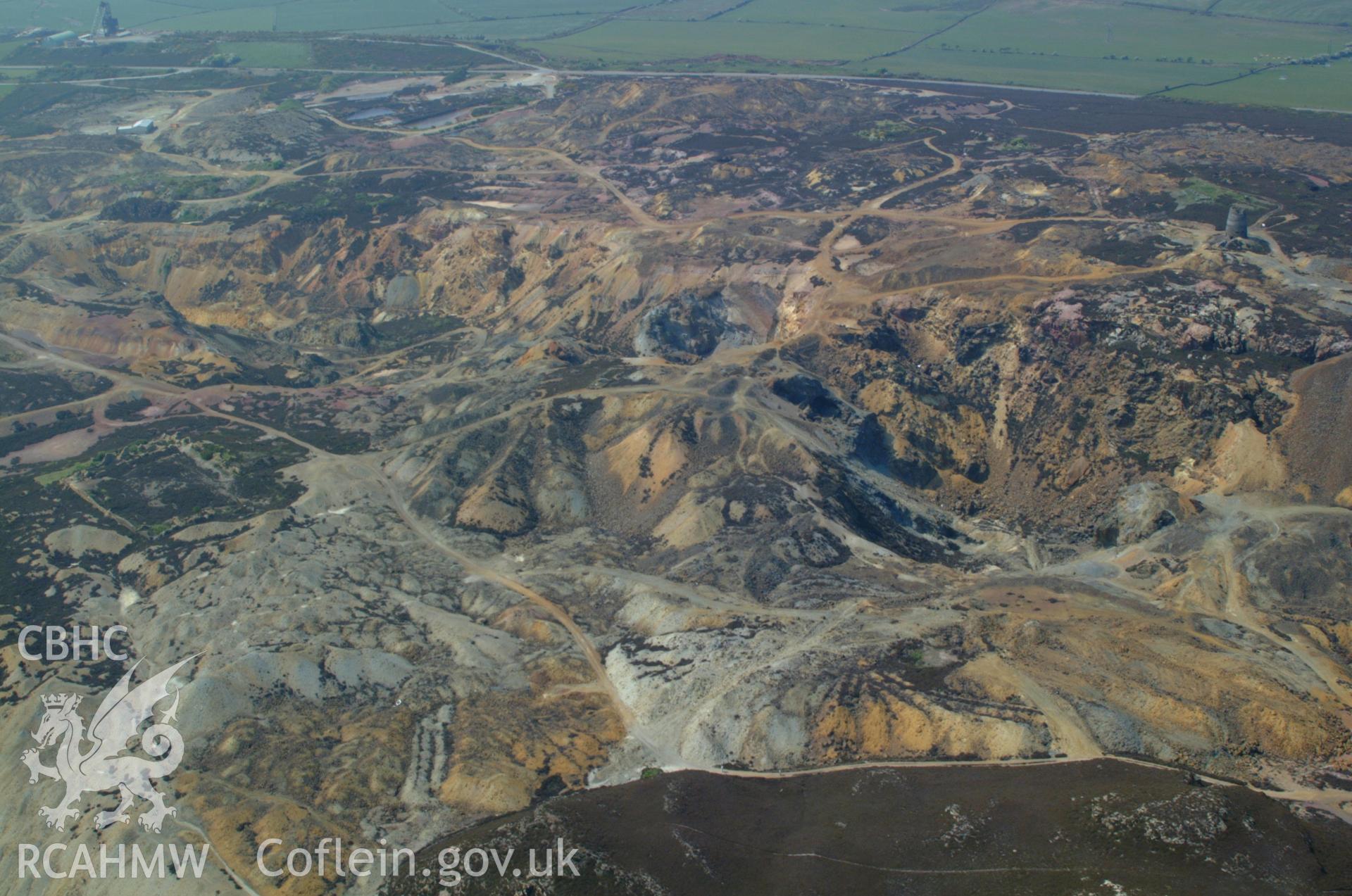 RCAHMW colour oblique aerial photograph of Parys Mountain showing Winding Gear in the distance. Taken on 26 May 2004 by Toby Driver