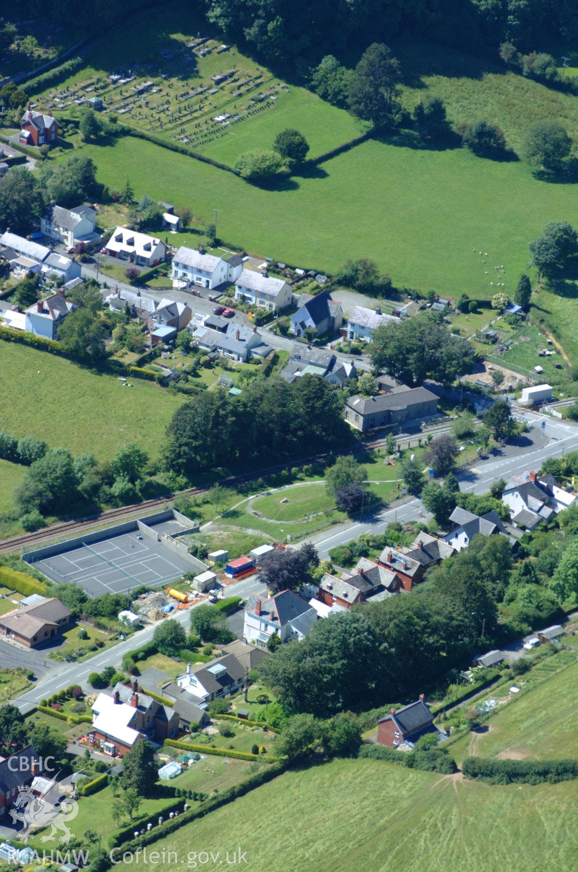 RCAHMW colour oblique aerial photograph of Llanfihangel Railway Station. Taken on 14 June 2004 by Toby Driver