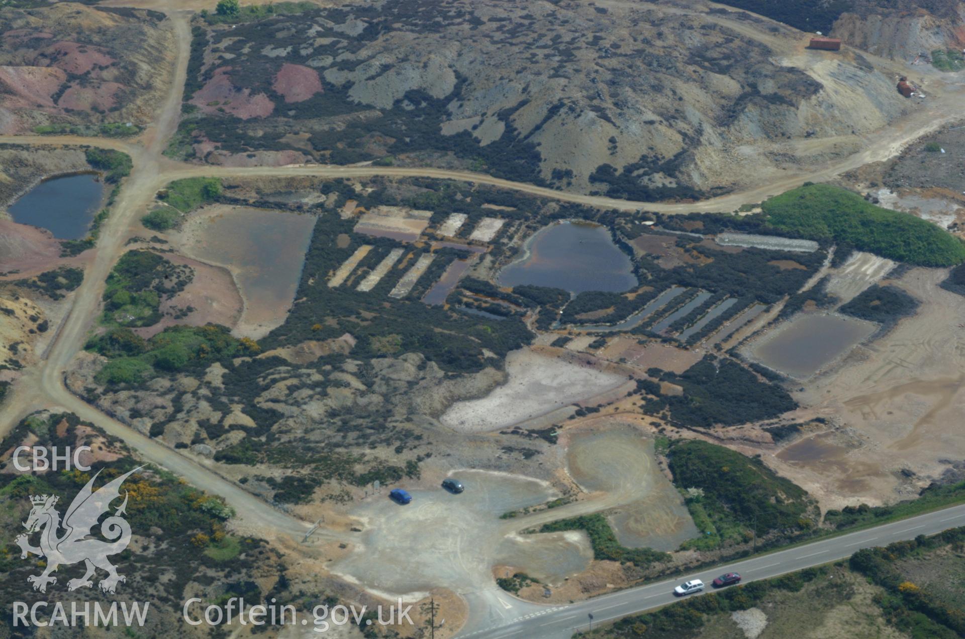 RCAHMW colour oblique aerial photograph of Solution Ponds, Parys Mountain. Taken on 26 May 2004 by Toby Driver