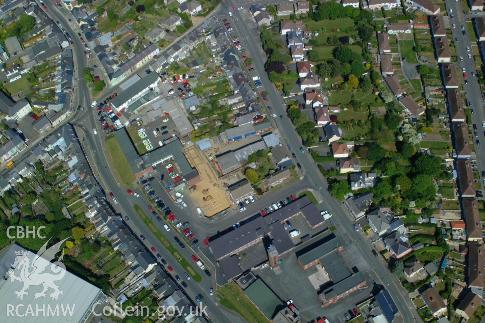 RCAHMW colour oblique aerial photograph of Haverfordwest showing excavations at Merlin's Hill. Taken on 24 May 2004 by Toby Driver