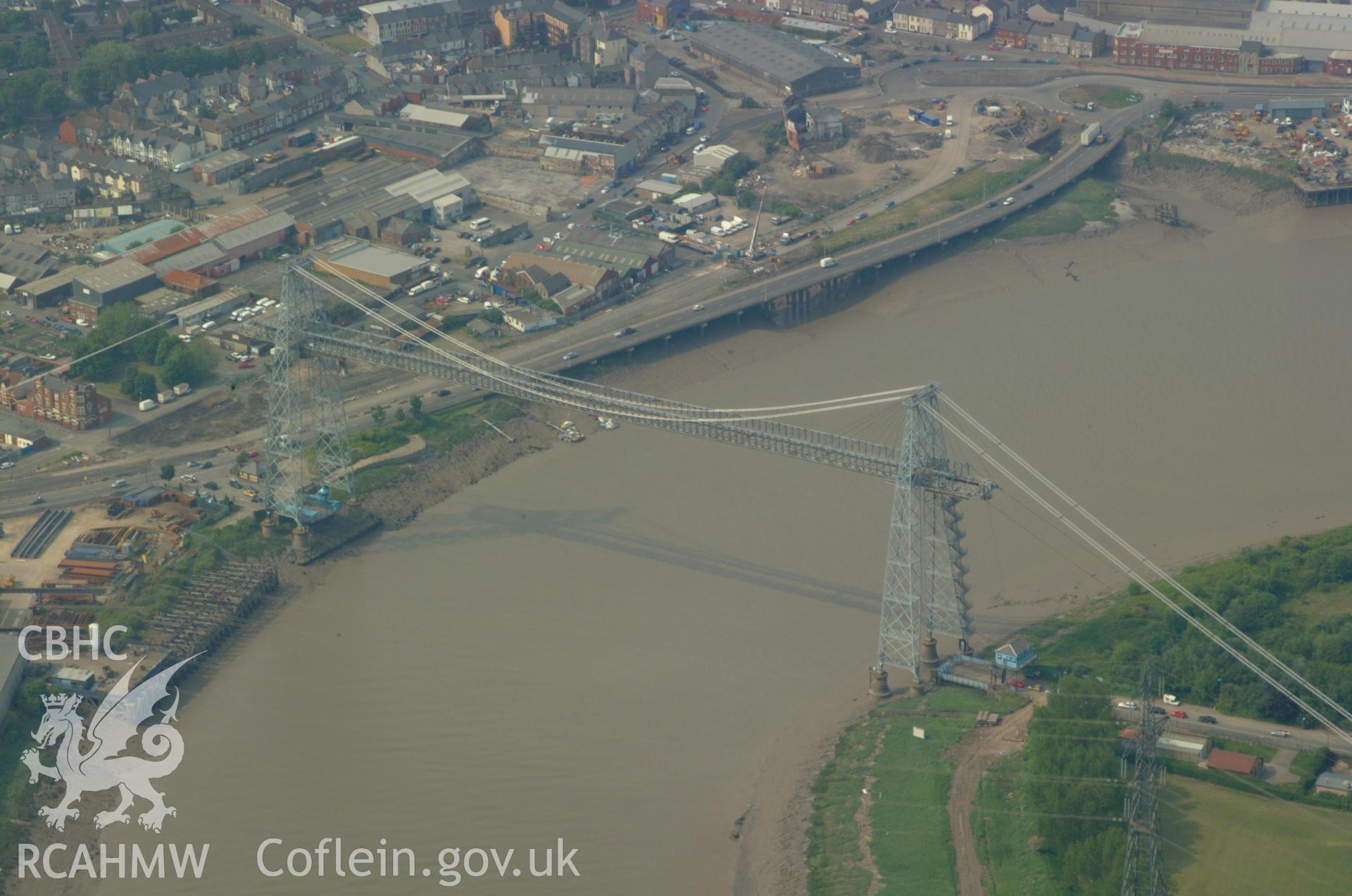 RCAHMW colour oblique aerial photograph of Newport Transporter Bridge, Newport taken on 26/05/2004 by Toby Driver