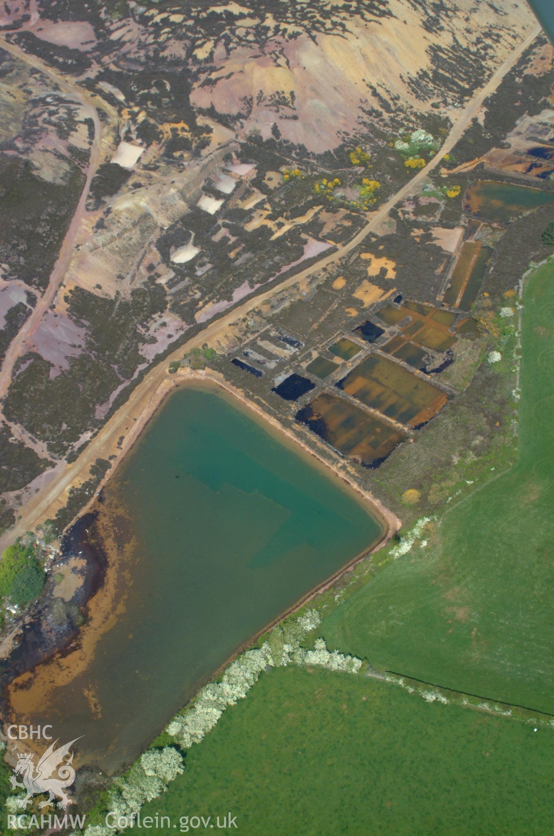 RCAHMW colour oblique aerial photograph of Pond Complex, Parys Mountain. Taken on 26 May 2004 by Toby Driver
