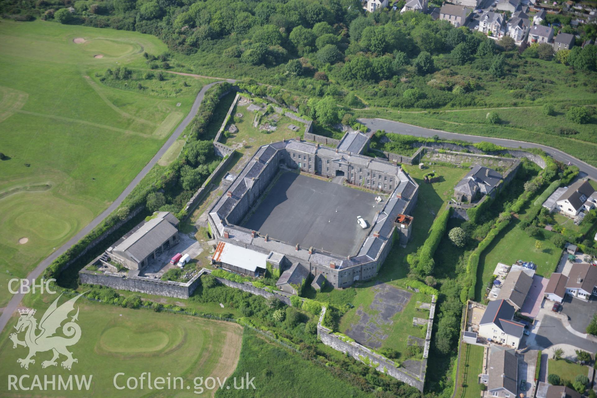 RCAHMW colour oblique aerial photograph of Barrack Hill, Pembroke Dockyard from the south-east. Taken on 08 June 2006 by Toby Driver.