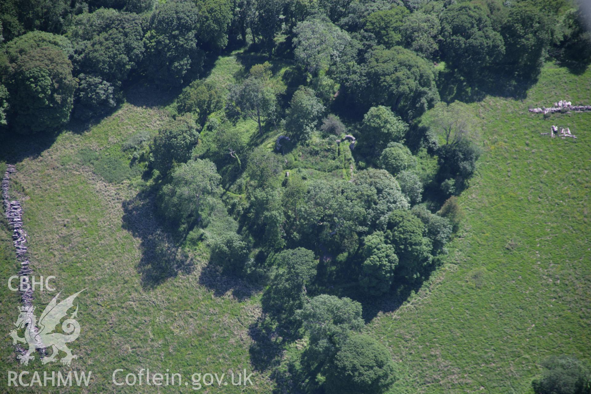 RCAHMW colour oblique aerial photograph of the castle earthworks and civil war fort at Castell Aberlleiniog, from the north. Taken on 14 June 2006 by Toby Driver.