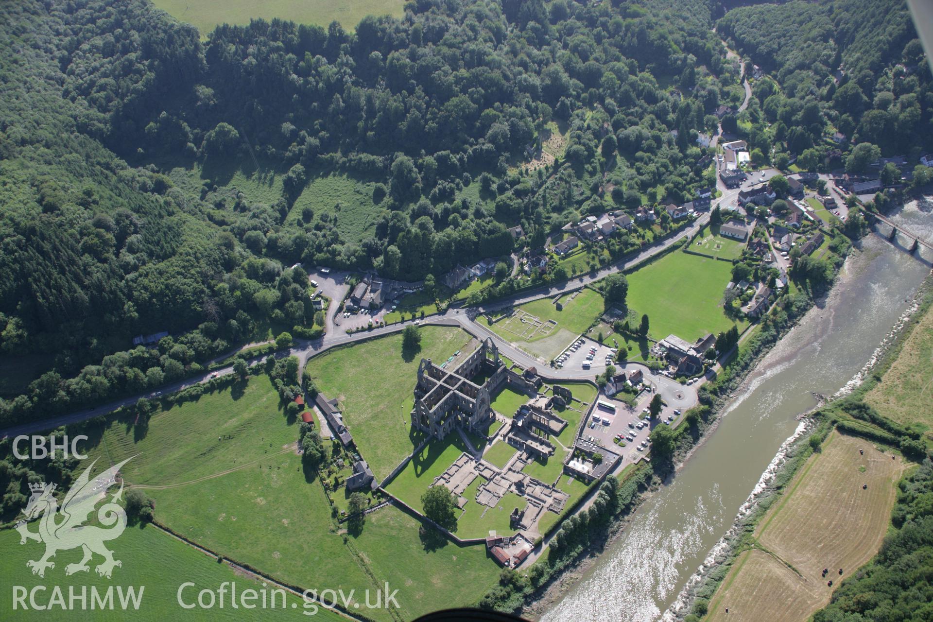 RCAHMW colour oblique aerial photograph of Tintern Abbey. Taken on 13 July 2006 by Toby Driver.
