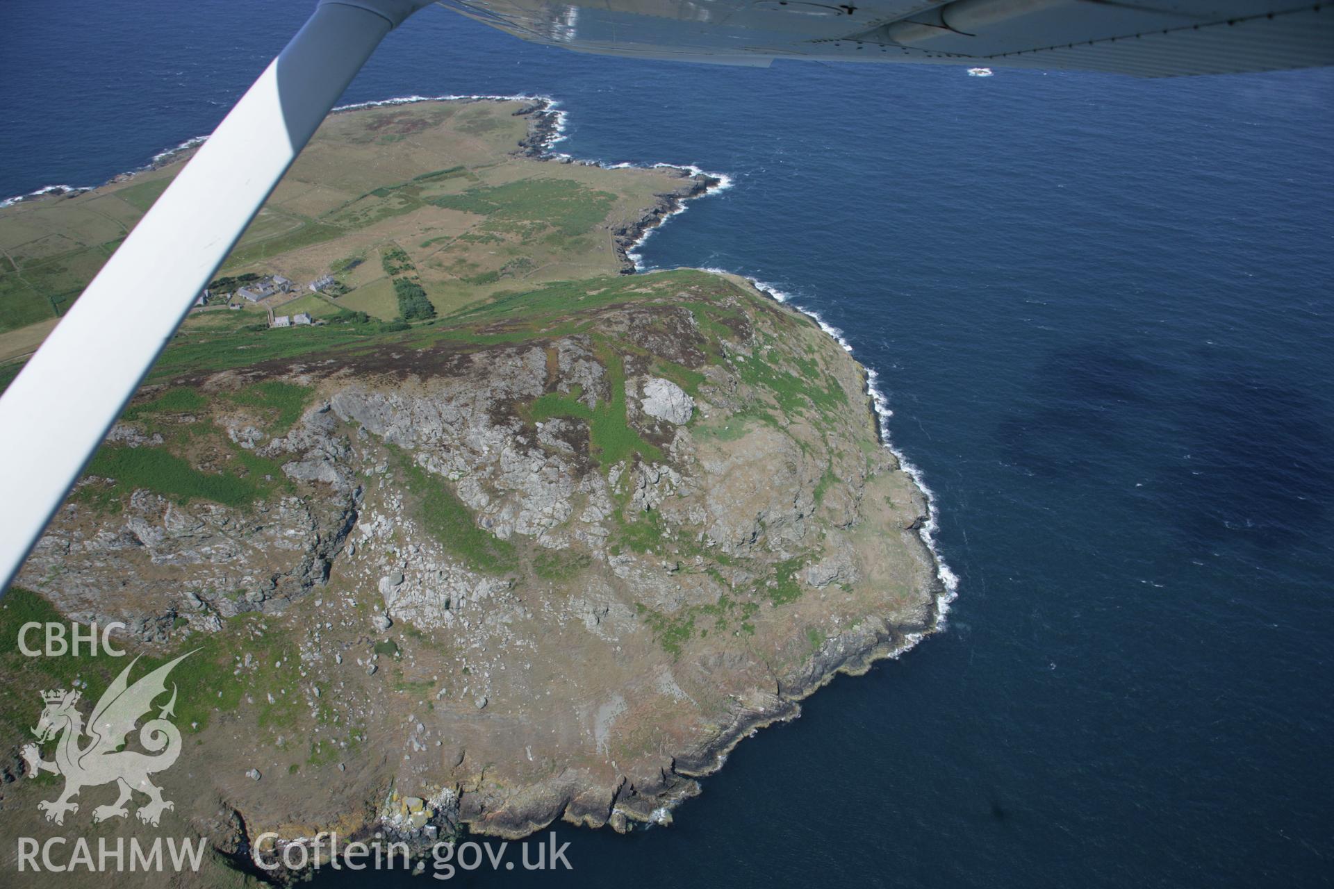 RCAHMW colour oblique aerial photograph of Bardsey Island (Ynys Enlli) showing the northern coast looking west. Taken on 03 August 2006 by Toby Driver.