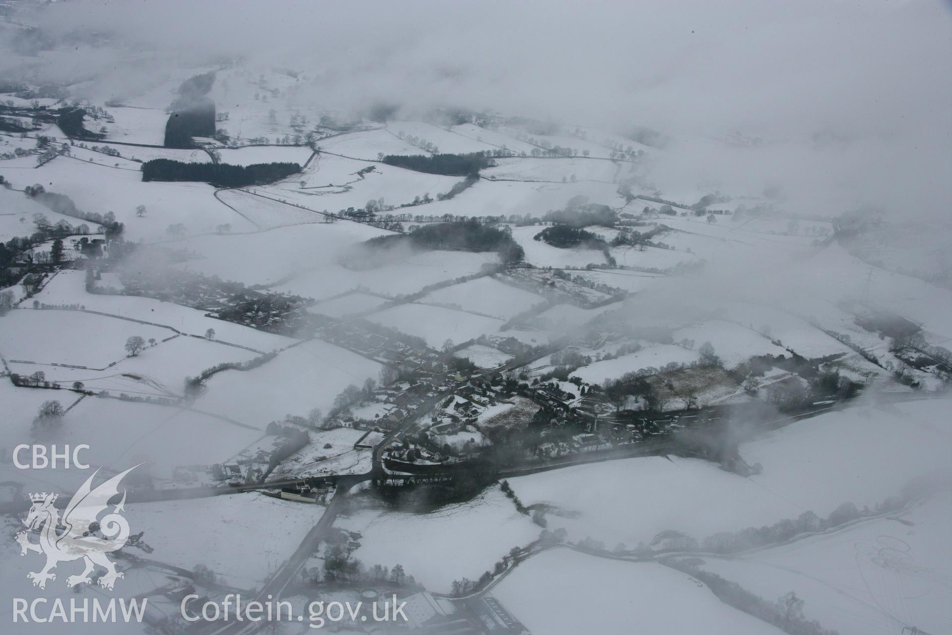 RCAHMW colour oblique aerial photograph of St Tecla's Church, Llandegla, from the south under snow. Taken on 06 March 2006 by Toby Driver.