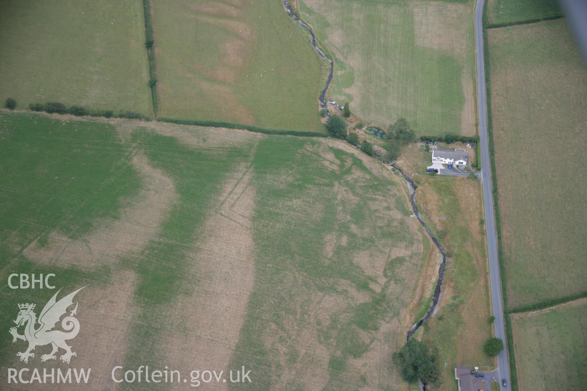 RCAHMW colour oblique aerial photograph of Nant Magwr Roman site, cropmarks from the west, by Toby Driver, 27/07/2006.