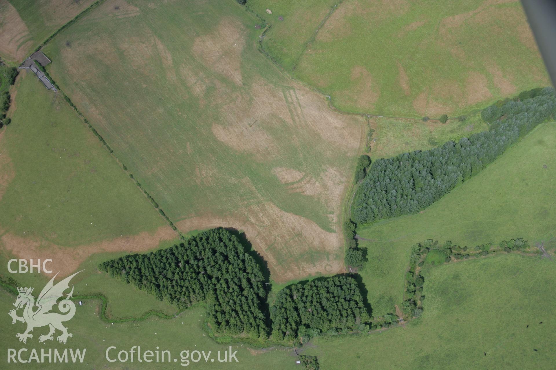 RCAHMW colour oblique aerial photograph of Llanfor Roman Military Complex visible in cropmarks, viewed from the south. Taken on 31 July 2006 by Toby Driver.