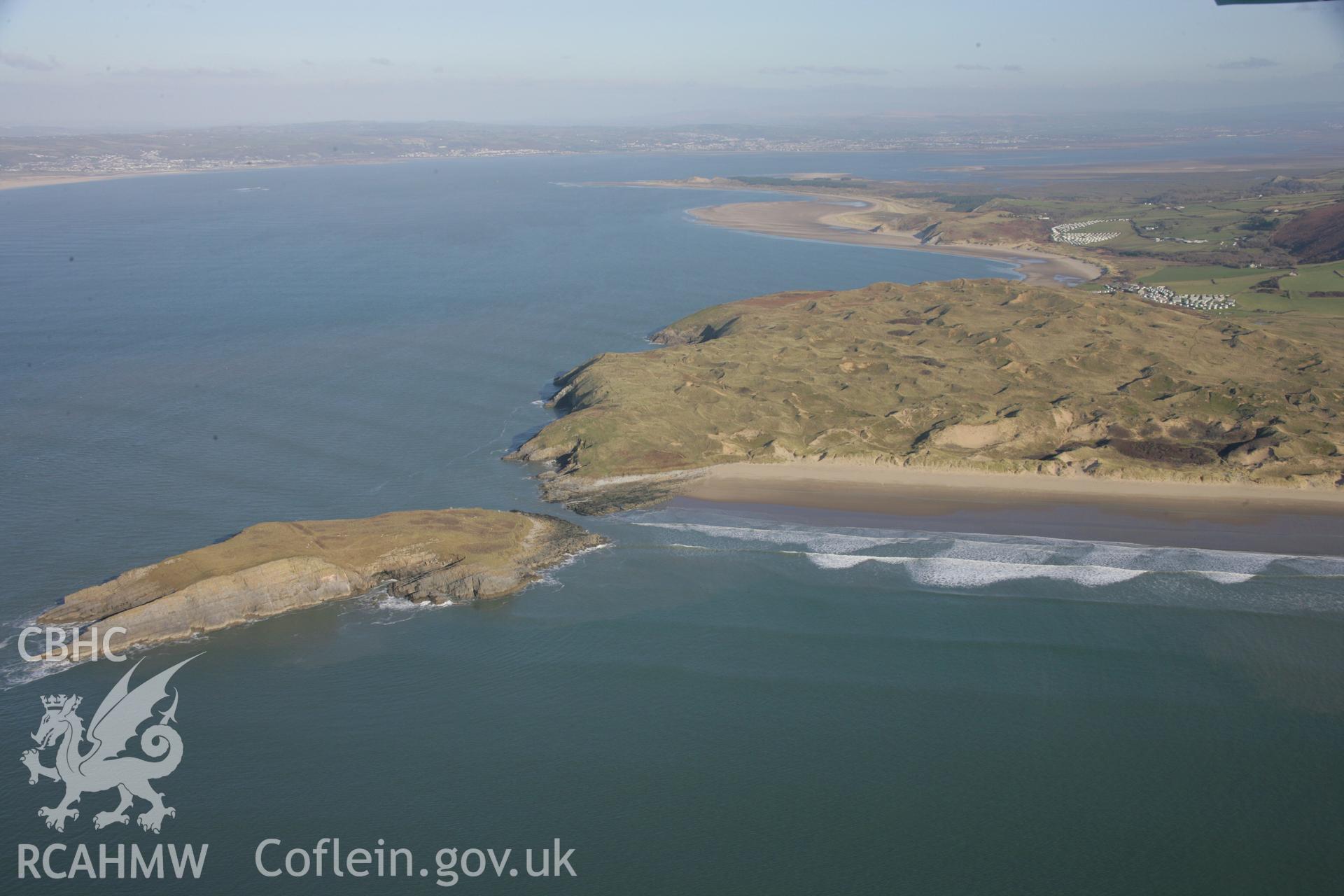 RCAHMW colour oblique aerial photograph of Burry Holms Promontory Fort. A view from the south-west looking over Llangennith Burrows. Taken on 26 January 2006 by Toby Driver.