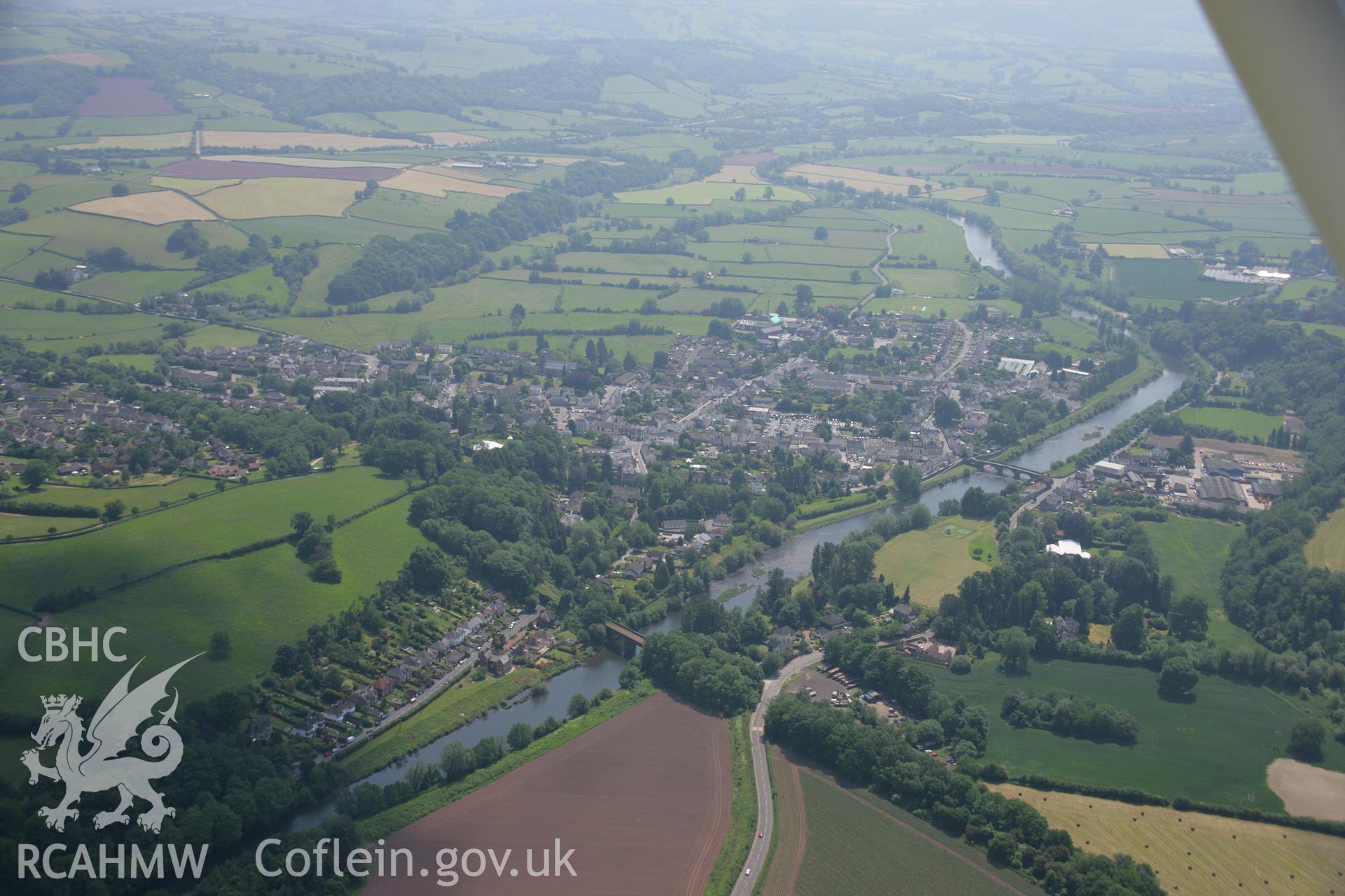 RCAHMW colour oblique aerial photograph of Usk from the north-west. Taken on 09 June 2006 by Toby Driver.