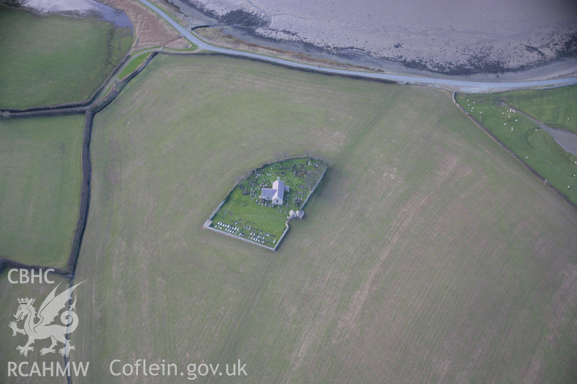 RCAHMW colour oblique aerial photograph of St Baglans Church from the north-east. Taken on 09 February 2006 by Toby Driver.