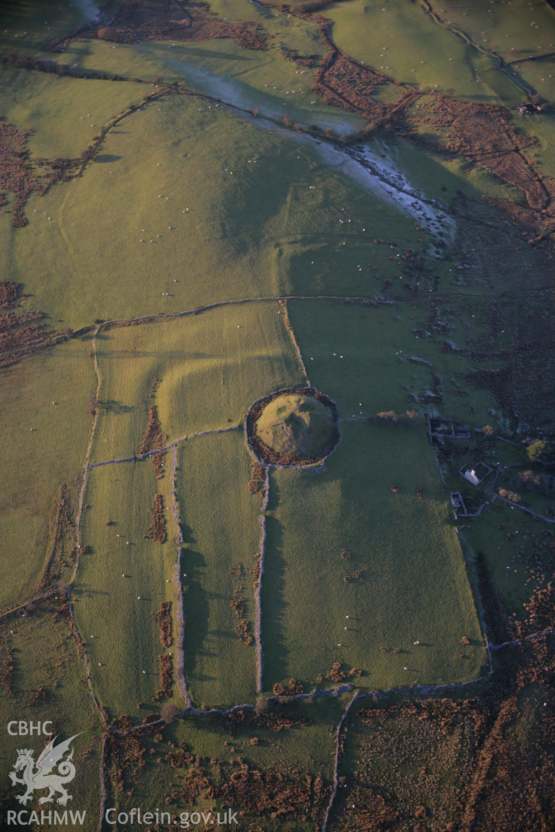 RCAHMW colour oblique aerial photograph of Tomen y Mur Roman Military Settlement. A view of the fort with the earthworks of the headquarter's building showing. Taken on 21 November 2005 by Toby Driver