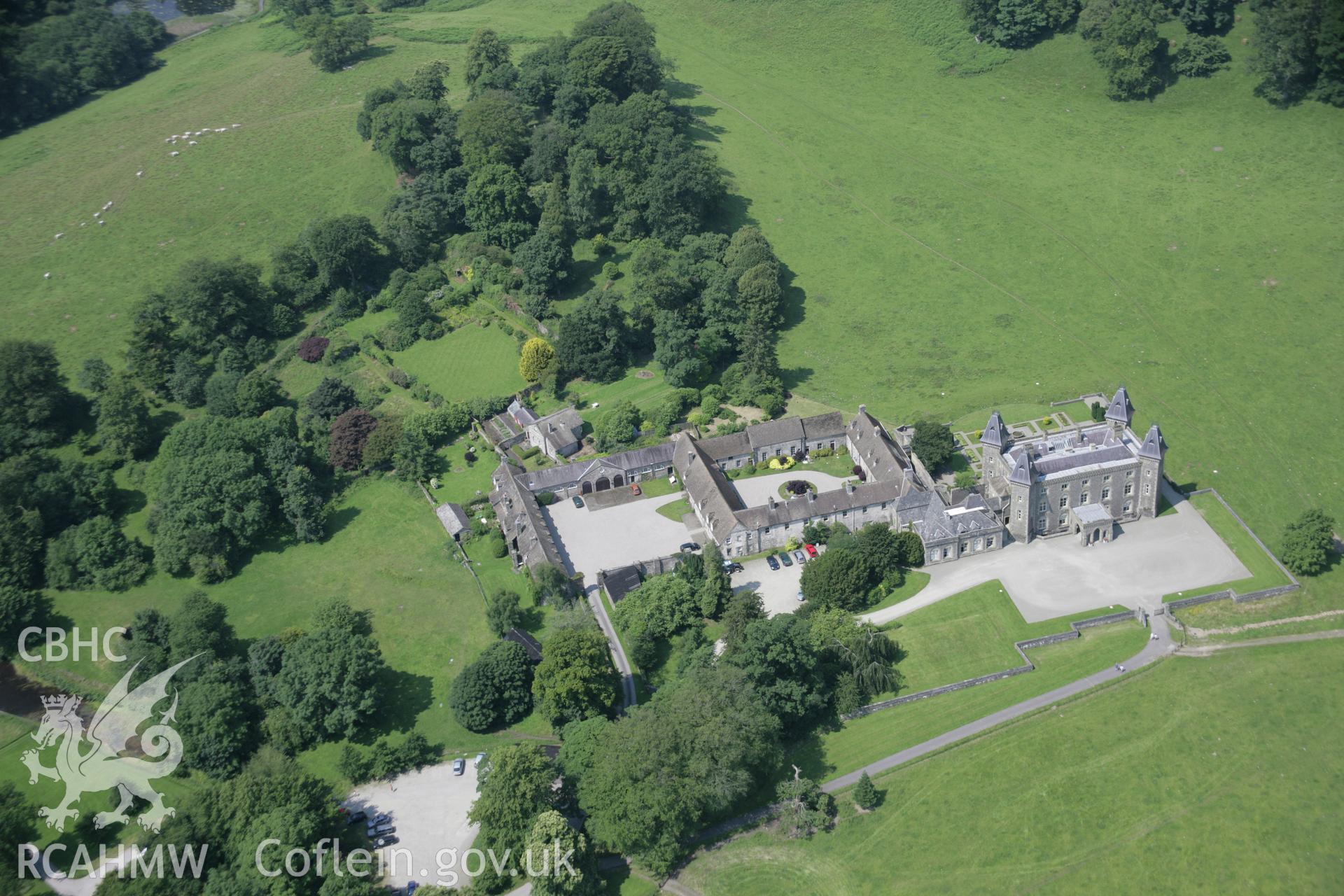 RCAHMW colour oblique aerial photograph of Newton House, (Dinefwr Castle), Llandeilo, in general view from the south-east. Taken on 11 July 2005 by Toby Driver