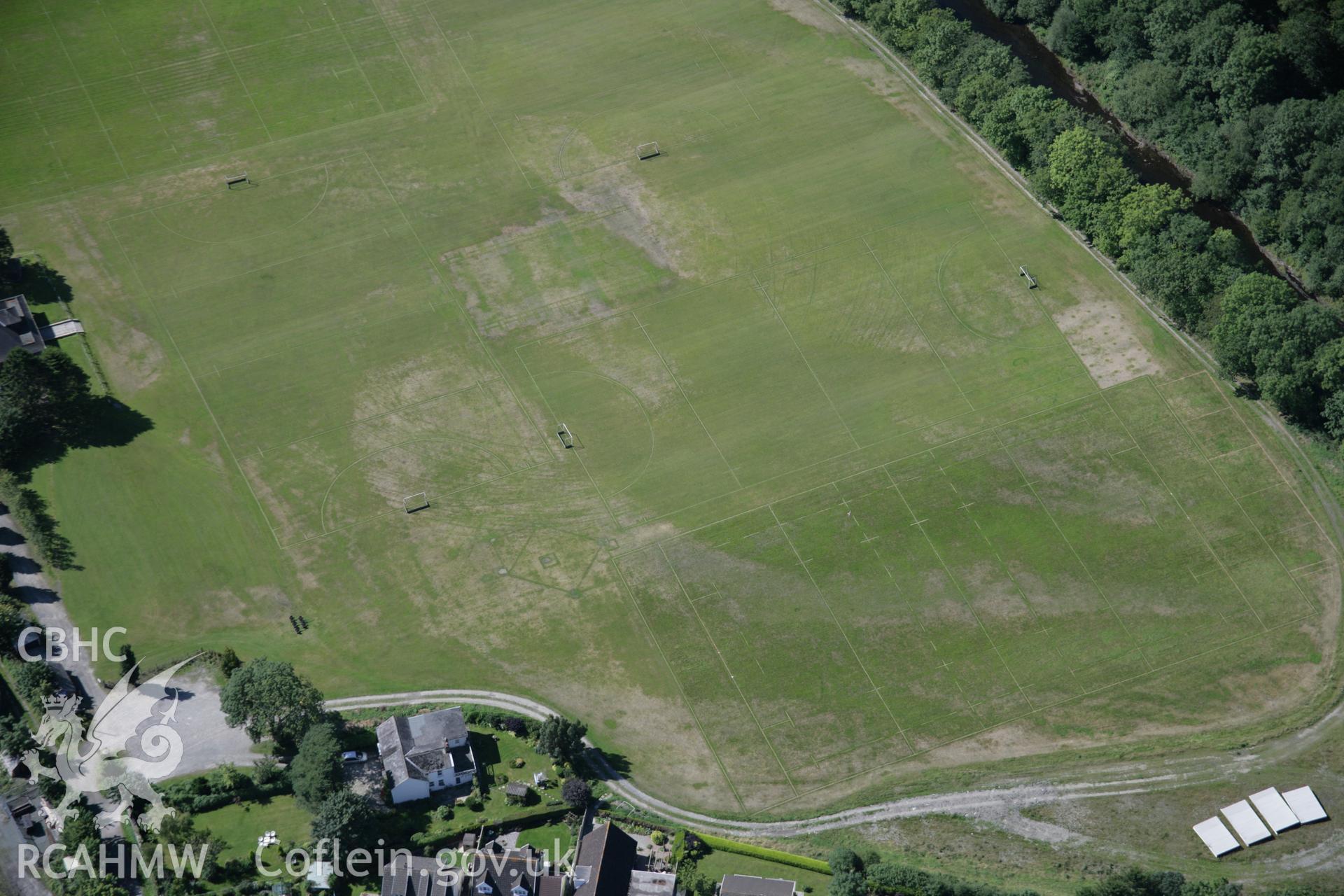 RCAHMW colour oblique aerial photograph of Llandovery from the east, with non-archaeological parchmarks on playing fields showing former river channels and pitches Taken on 02 September 2005 by Toby Driver