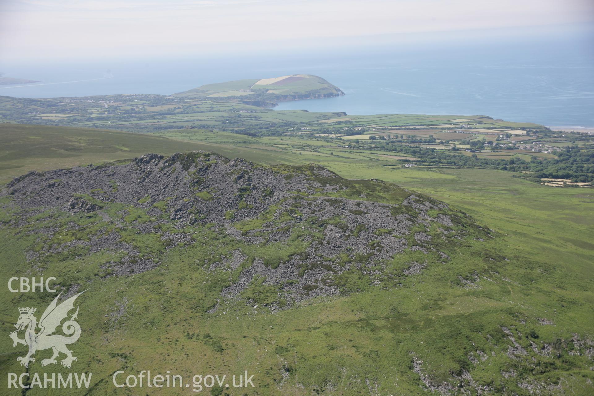 RCAHMW colour oblique aerial photograph of Carn Ingli Camp. A view from the south-east towards Dinas Head. Taken on 23 June 2005 by Toby Driver
