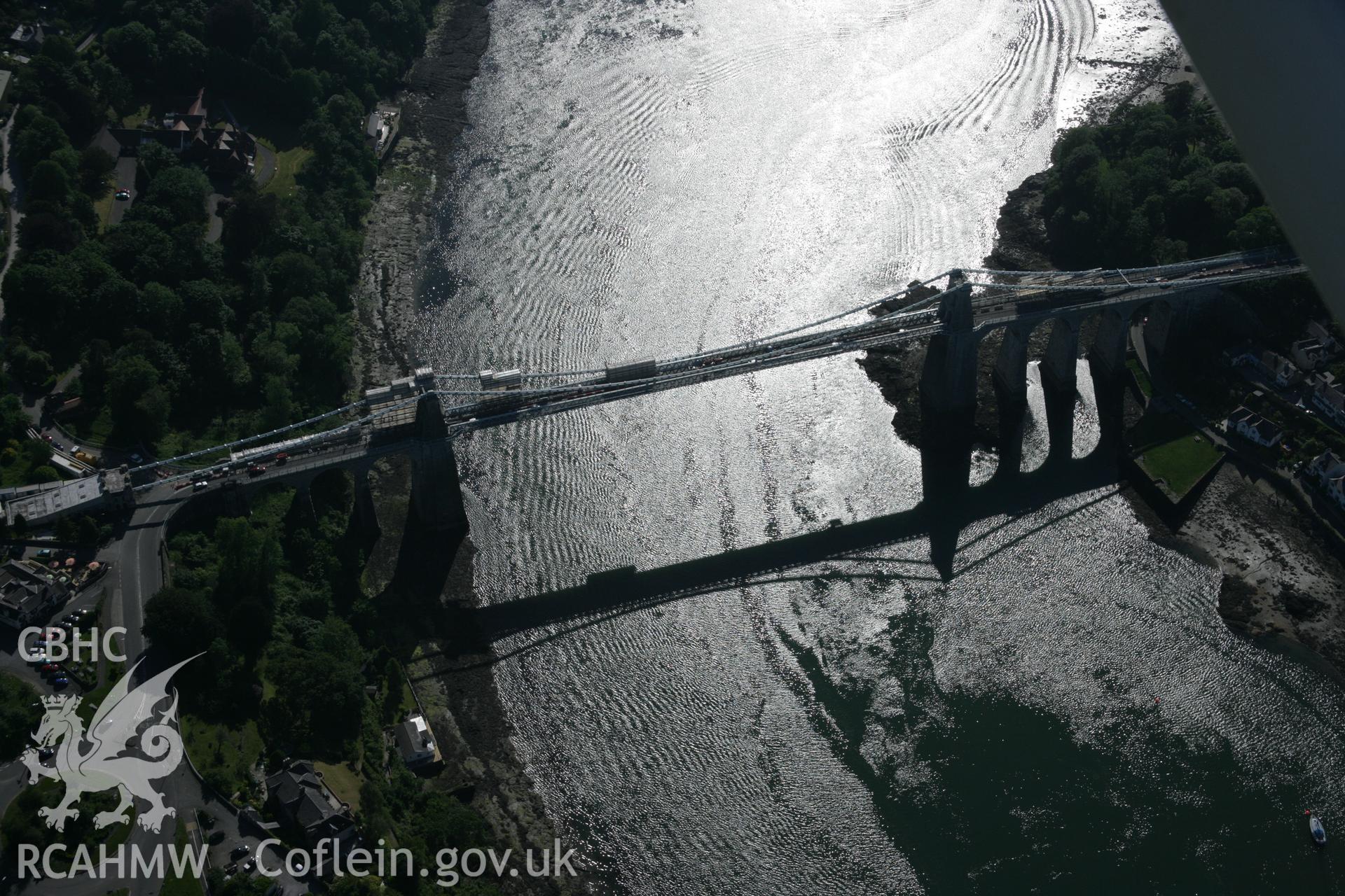 RCAHMW digital colour oblique photograph of Menai Suspension Bridge viewed from the north-east. Taken on 08/06/2005 by T.G. Driver.